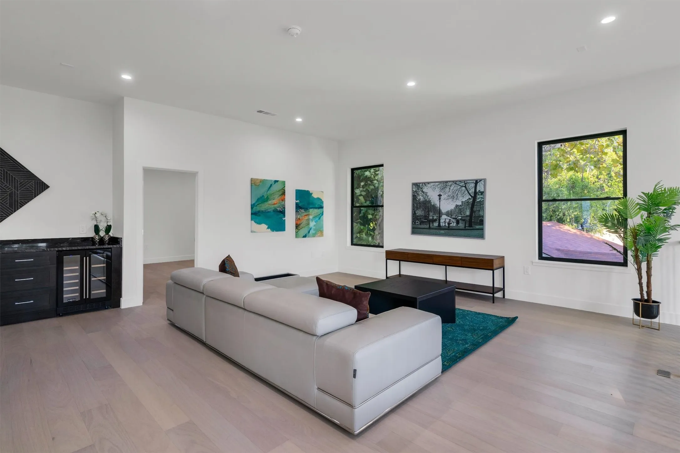 Living room featuring wood finished floors, recessed lighting, and baseboards