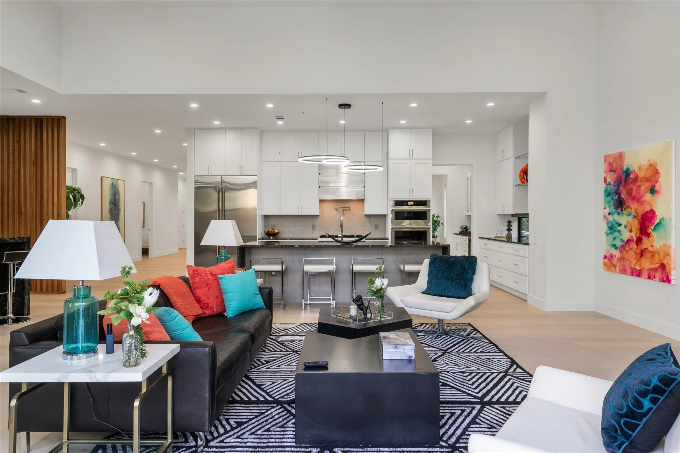 Living area with light wood-style flooring, recessed lighting, and baseboards