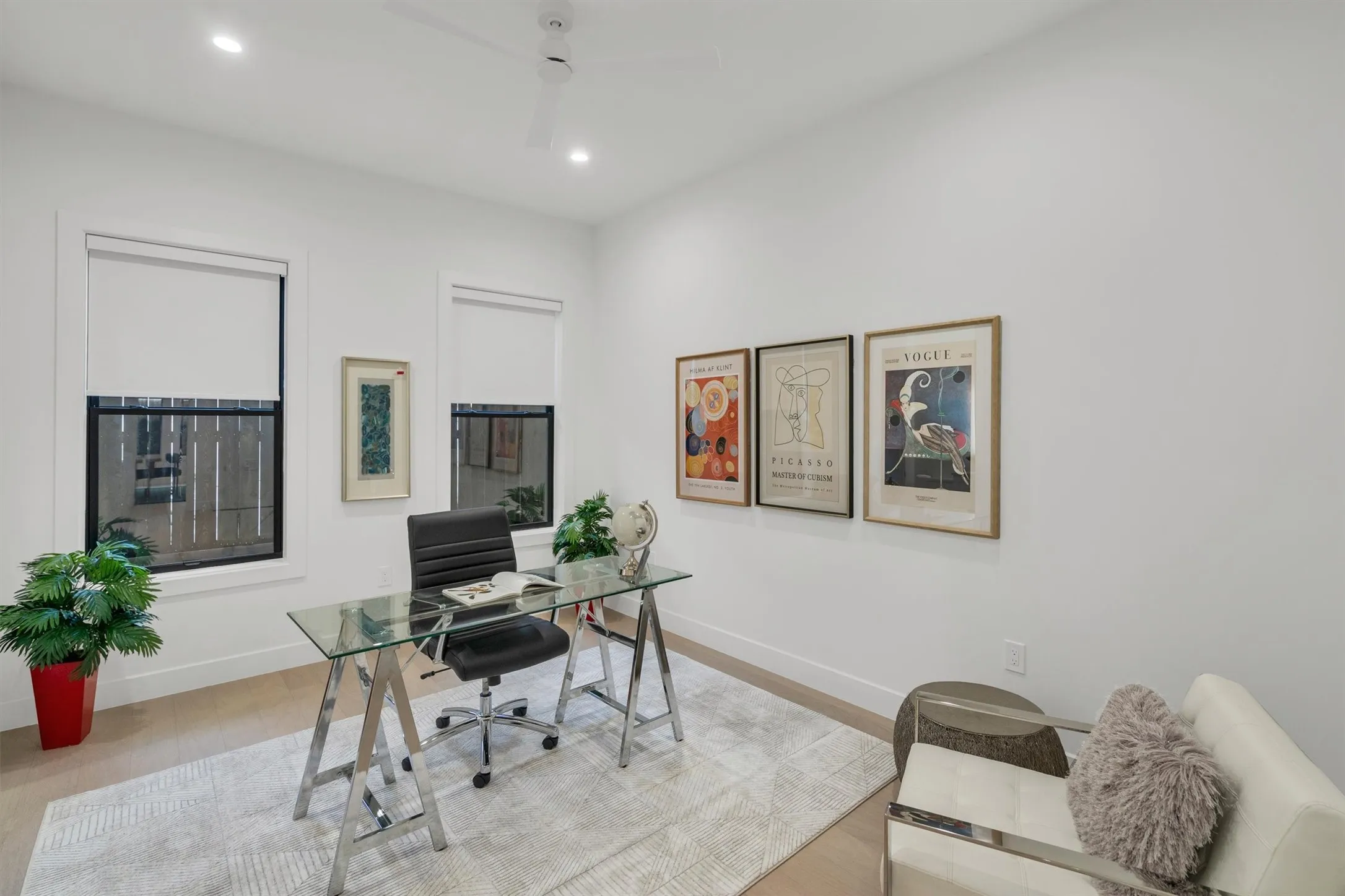 Office space with baseboards, a ceiling fan, wood finished floors, and recessed lighting