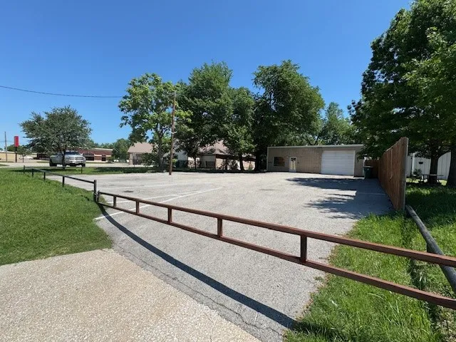 View of yard featuring fence