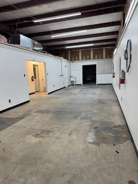 Garage featuring baseboards