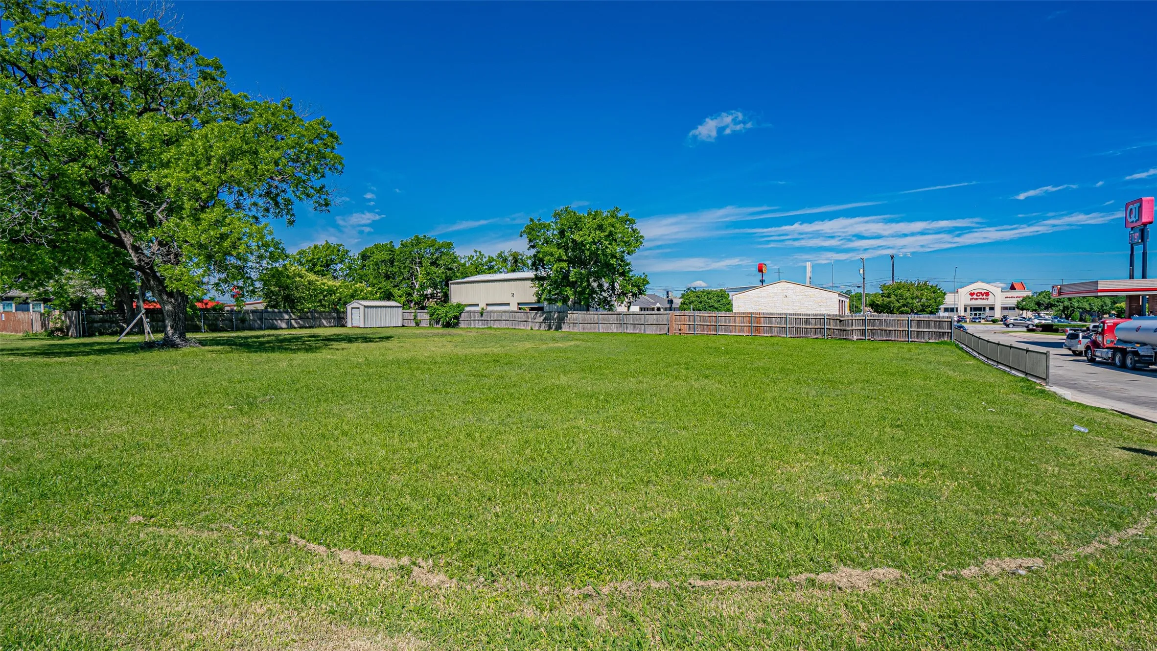 View of yard with a storage shed and an outdoor structure
