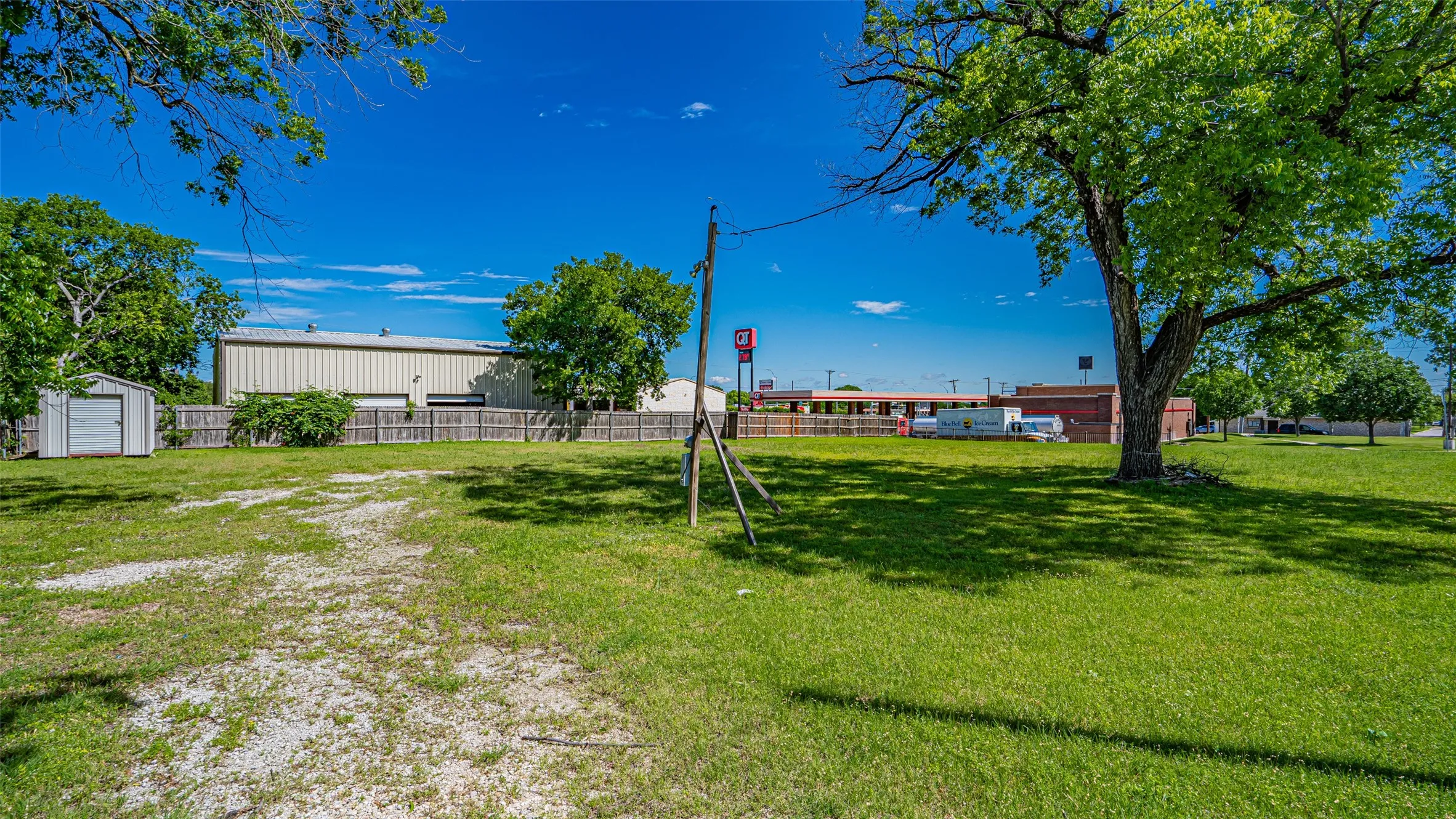 View of yard with a storage shed and an outbuilding