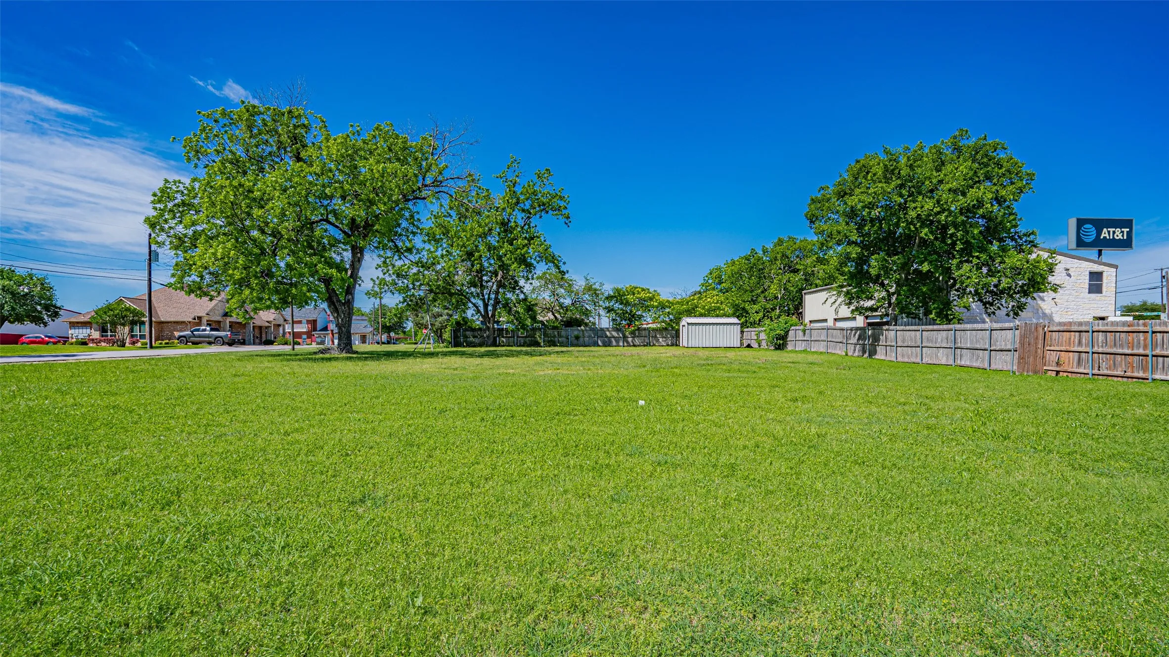 View of yard featuring a storage unit and an outdoor structure