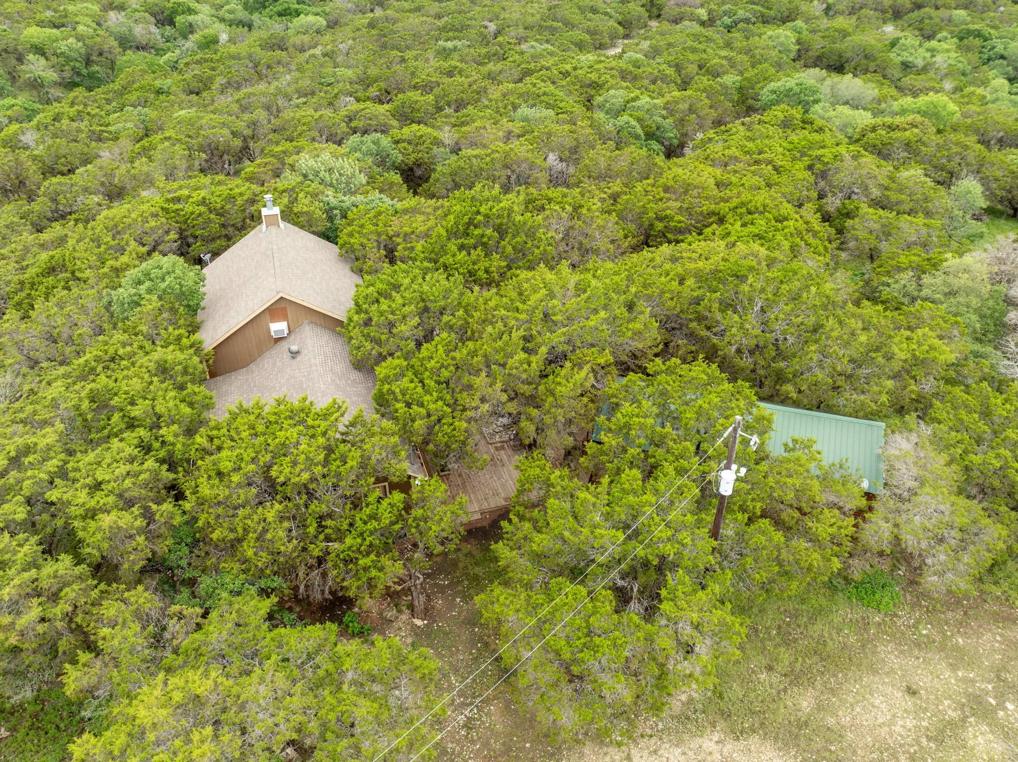 View from above of property with a forest