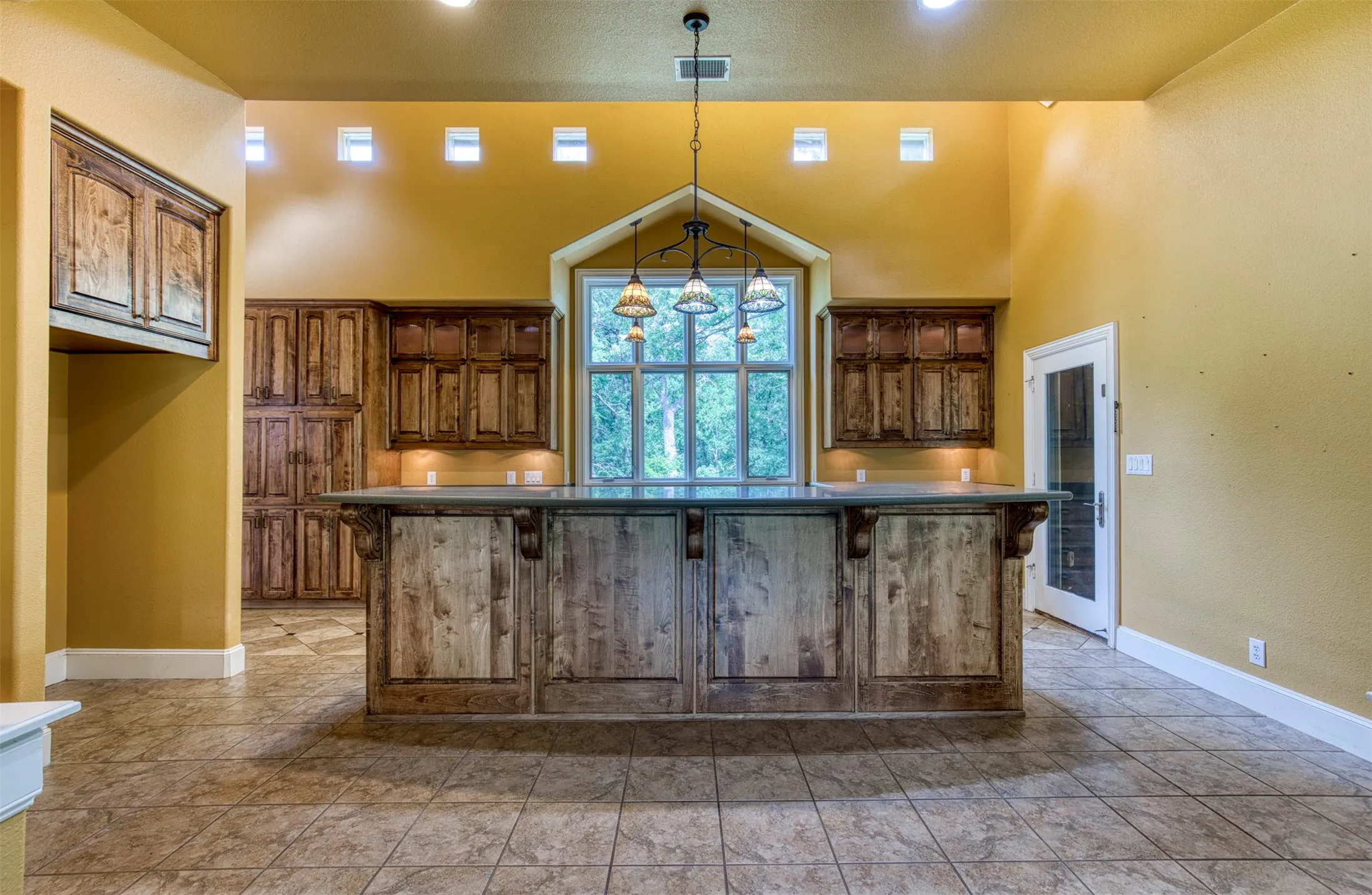 Kitchen with high ceilings and natural light.