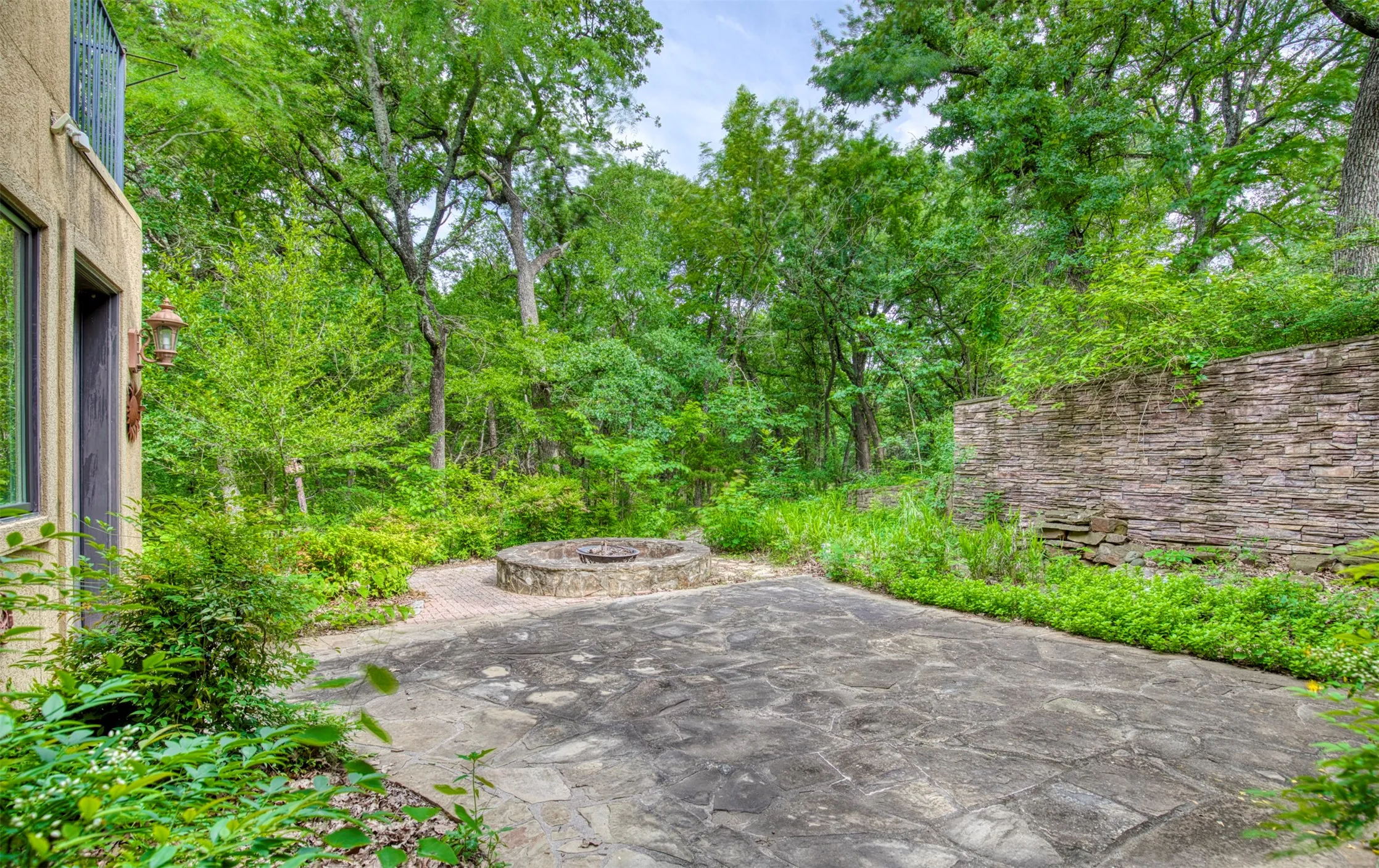 Patio courtyard area with fire pit.