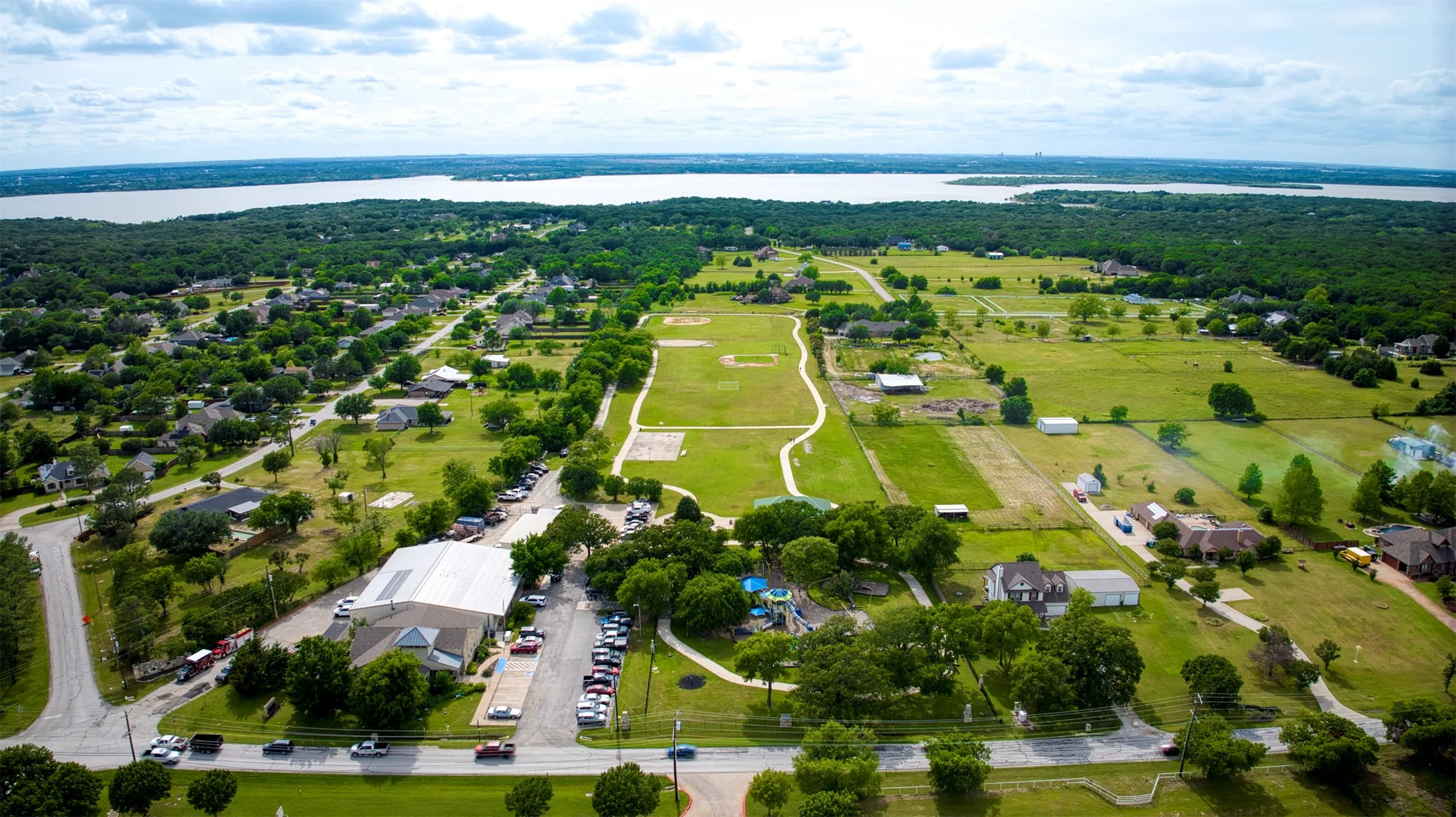 Aerial view of community and Lake Lewisville with boat dock.