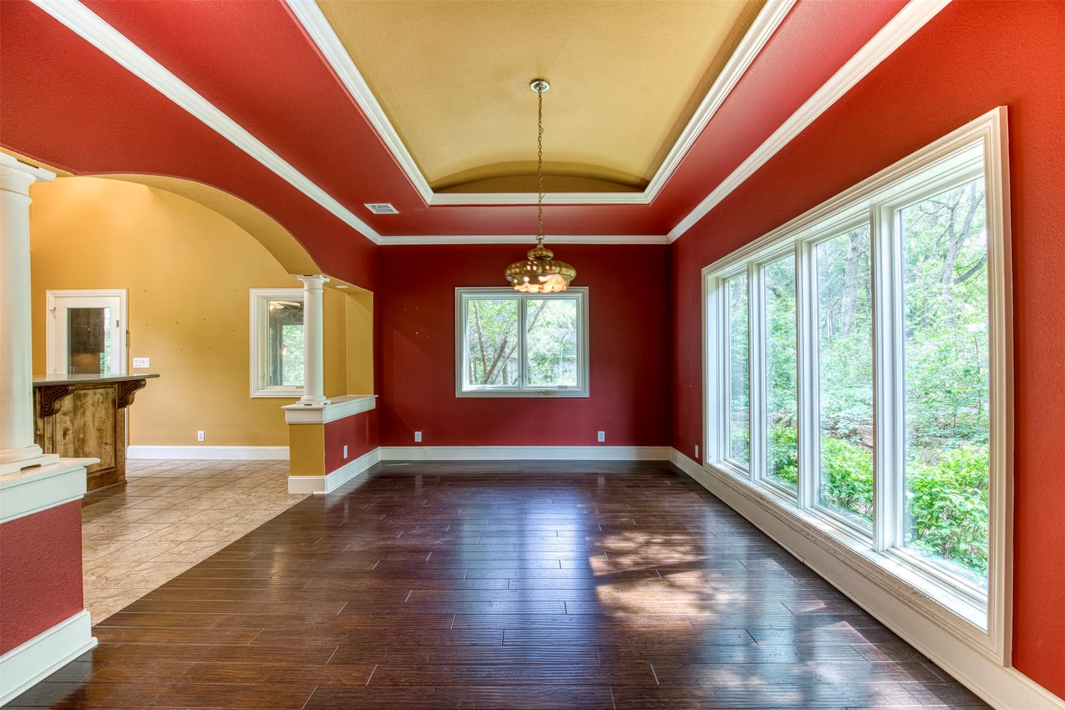 Dining room with trey ceiling overlooking the front of the estate.
