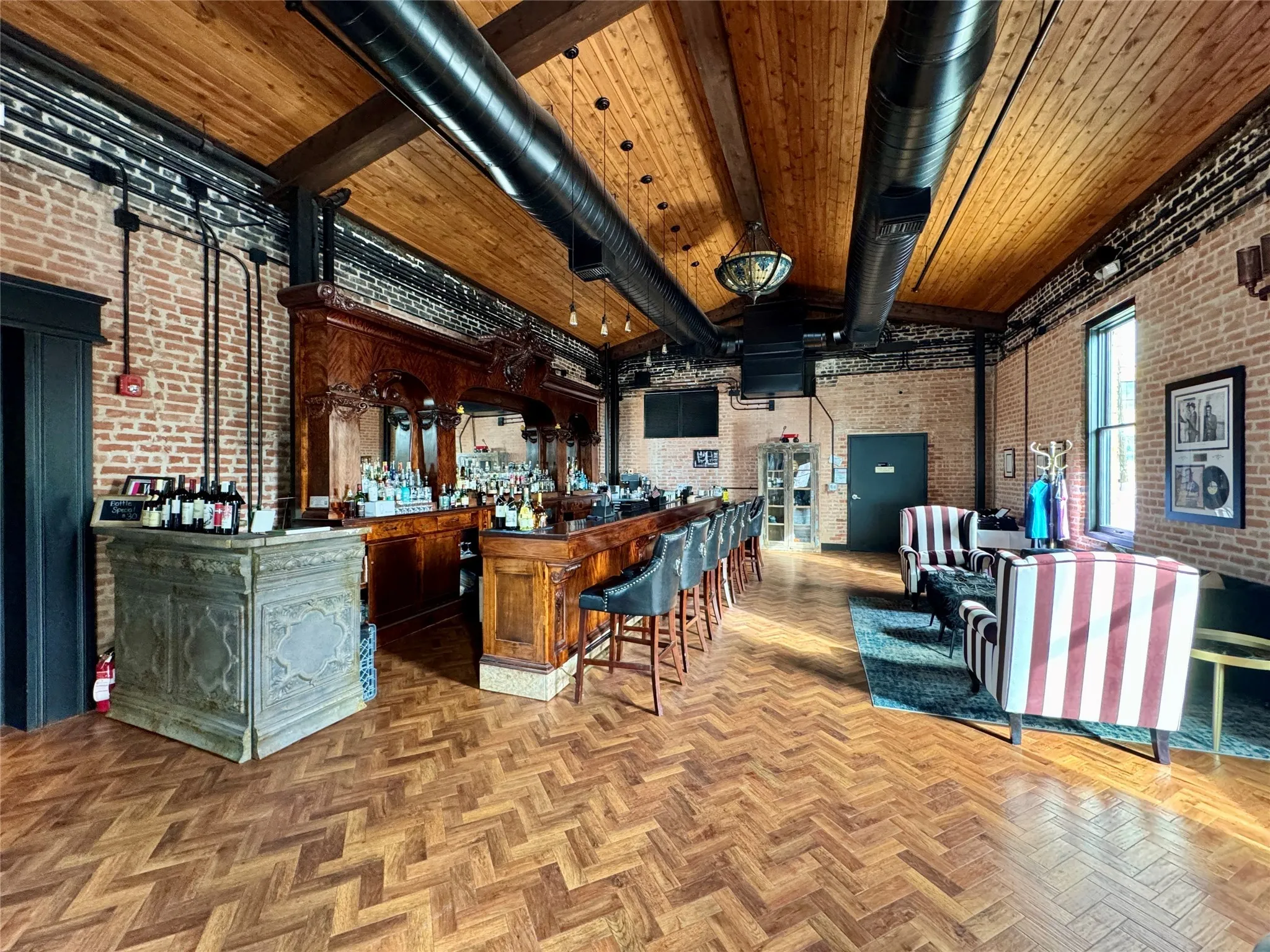 Community bar area featuring brick wall