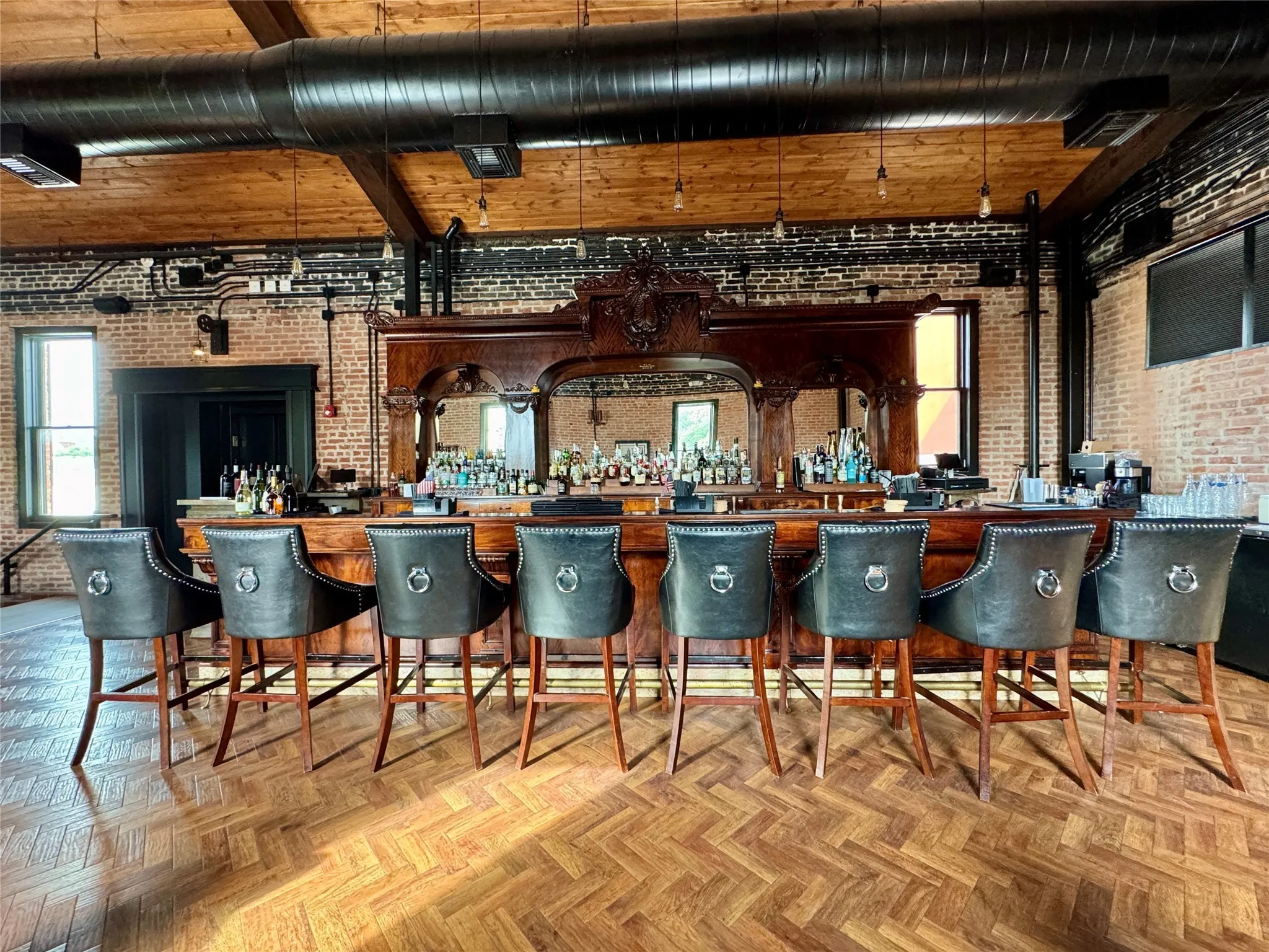 Community bar area featuring brick wall