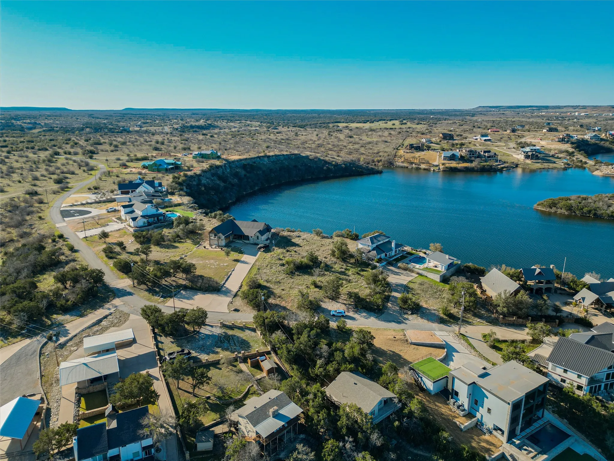 Aerial view featuring a water view and a residential view