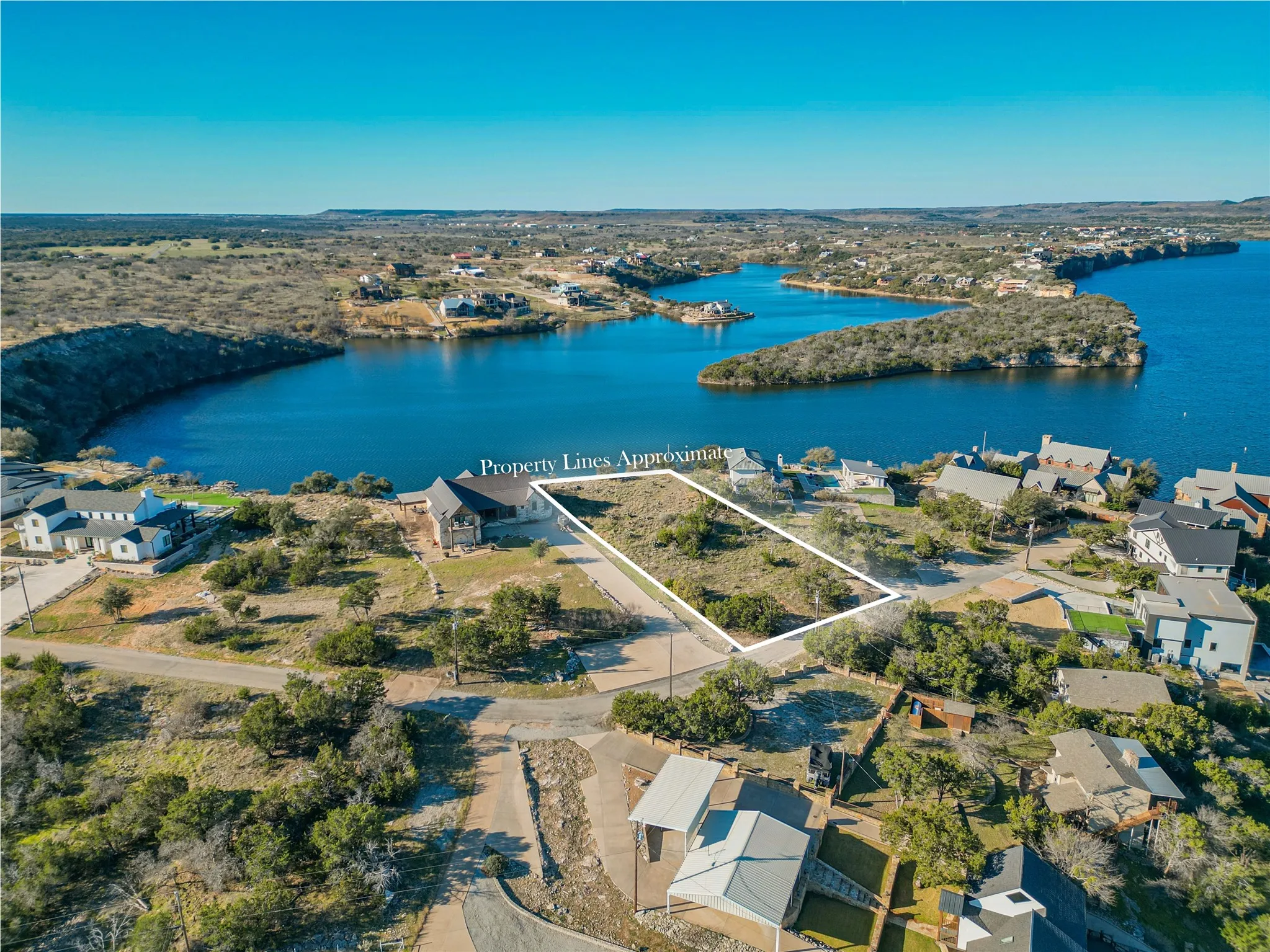 Birds eye view of property featuring a residential view and a water view