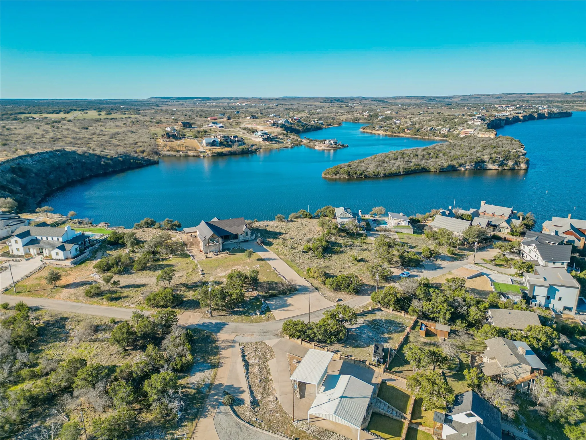 Drone / aerial view featuring a residential view and a water view