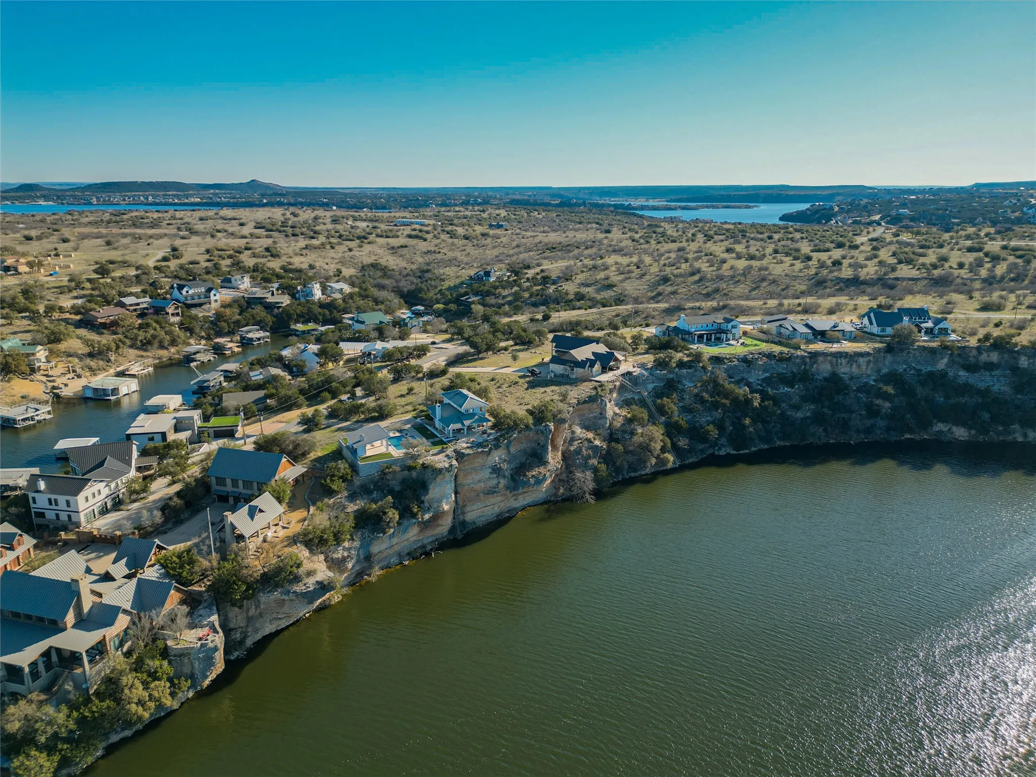 Birds eye view of property featuring a water and mountain view