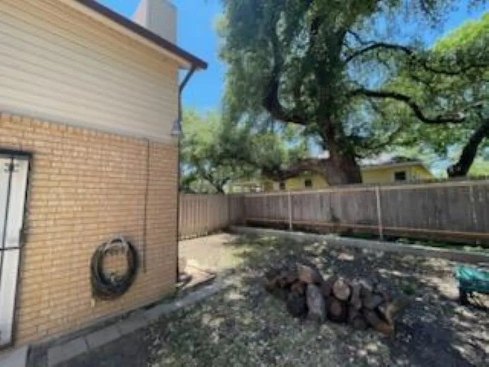 View of fenced backyard