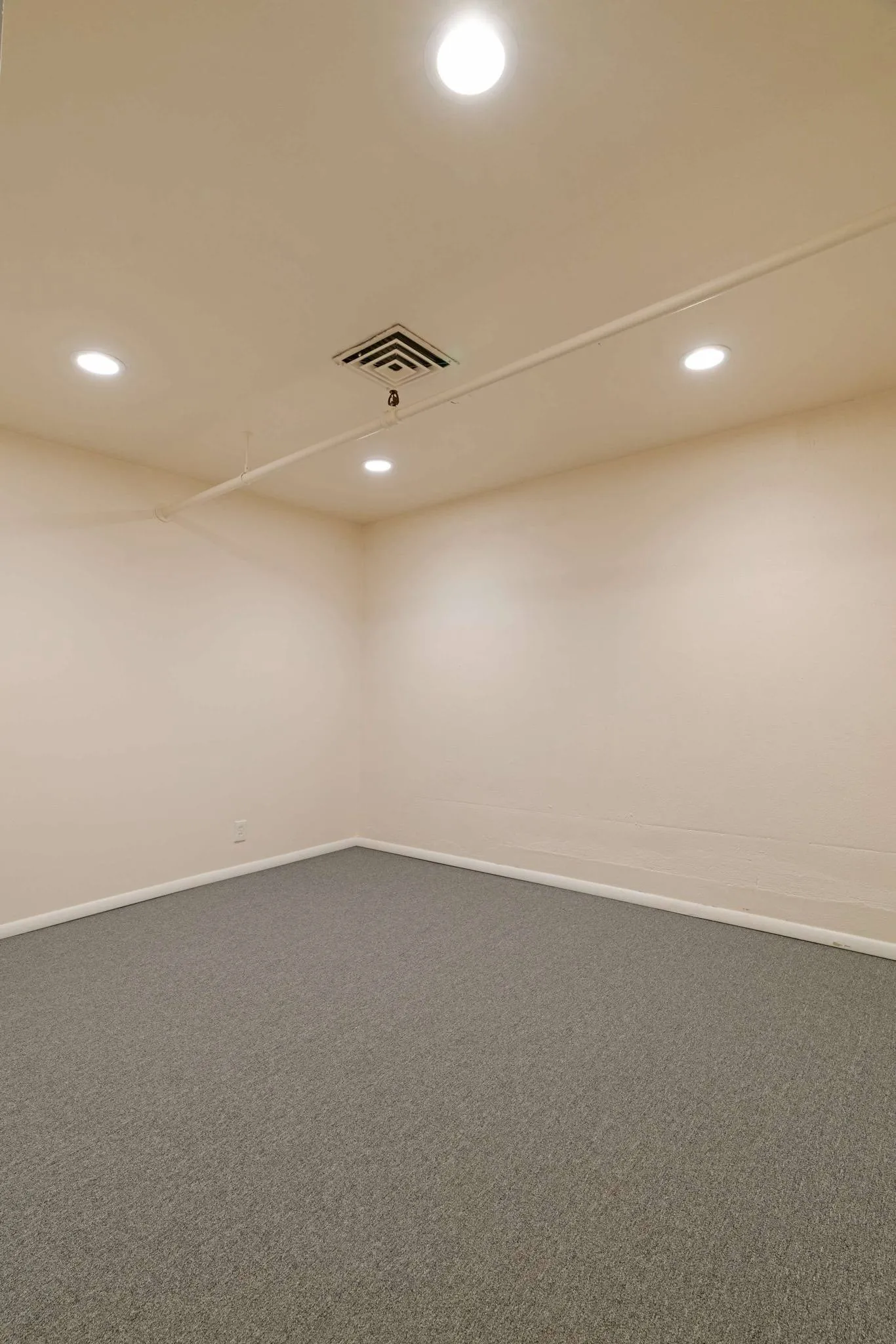 Spare room featuring recessed lighting, carpet flooring, and baseboards