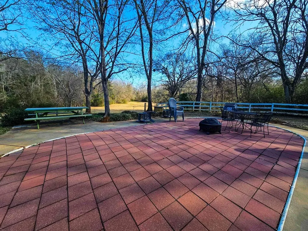 View of patio featuring a fire pit