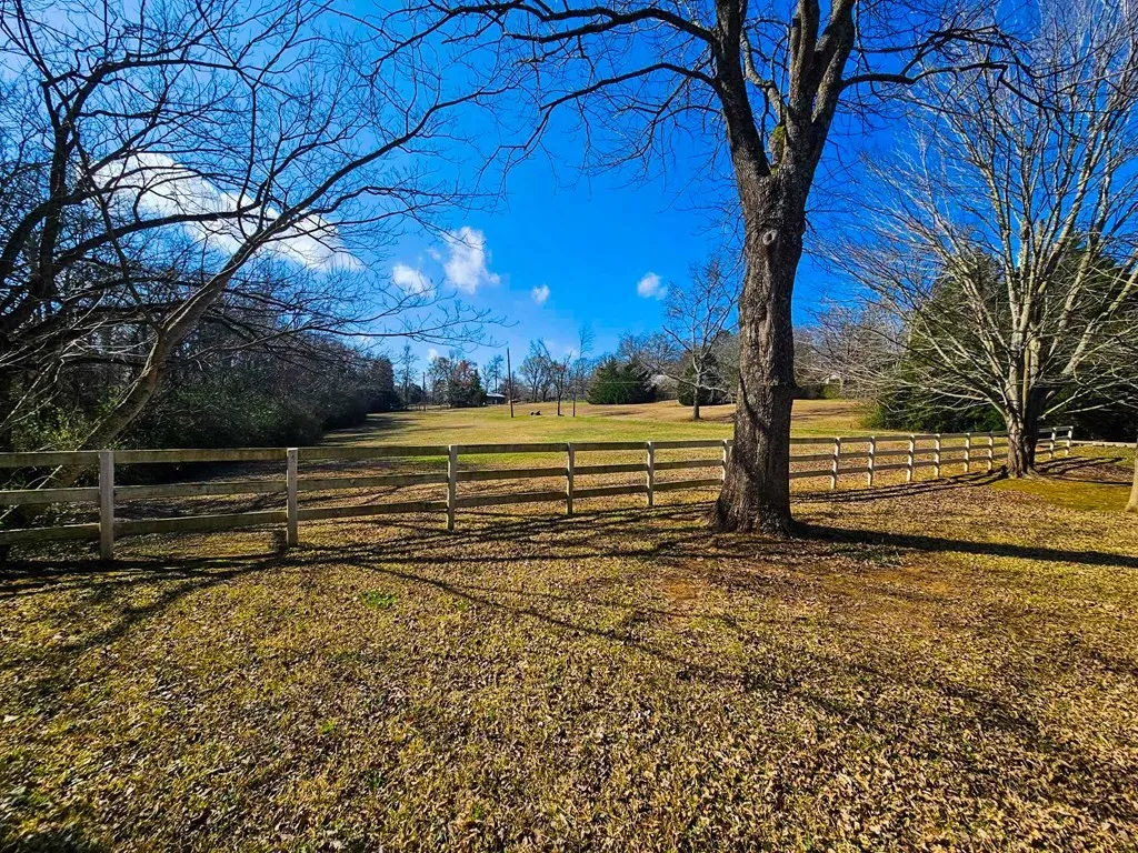 View of yard with a rural view