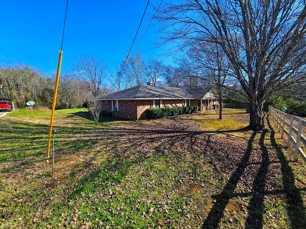 View of side of home with brick siding