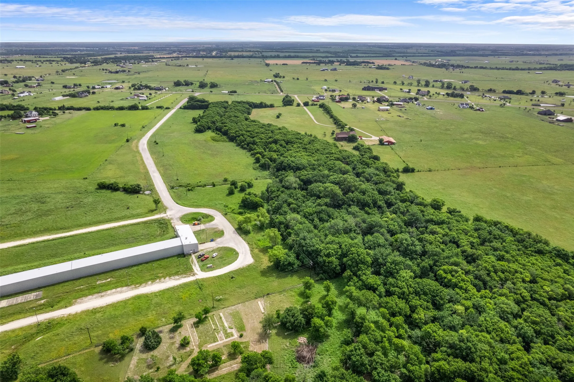 Aerial view of sparsely populated area with a pastoral area