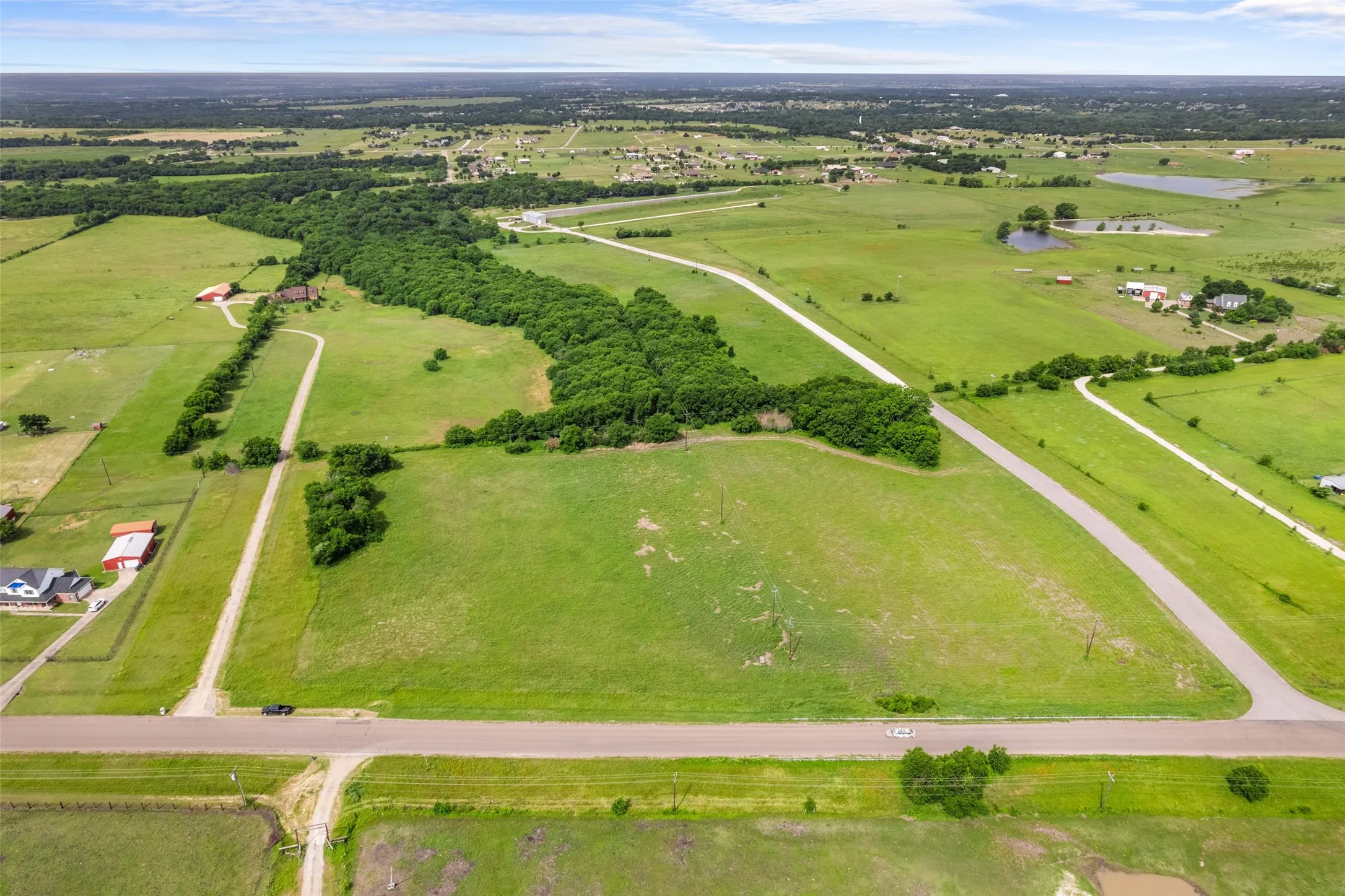 View of rural area featuring a nearby body of water