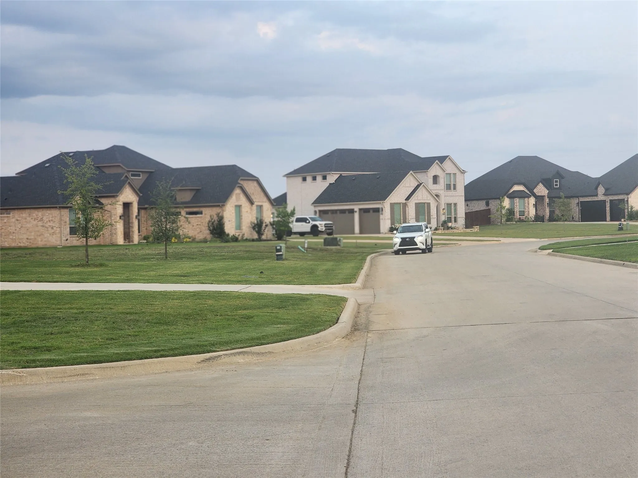 View of concrete street with curbs and a residential view