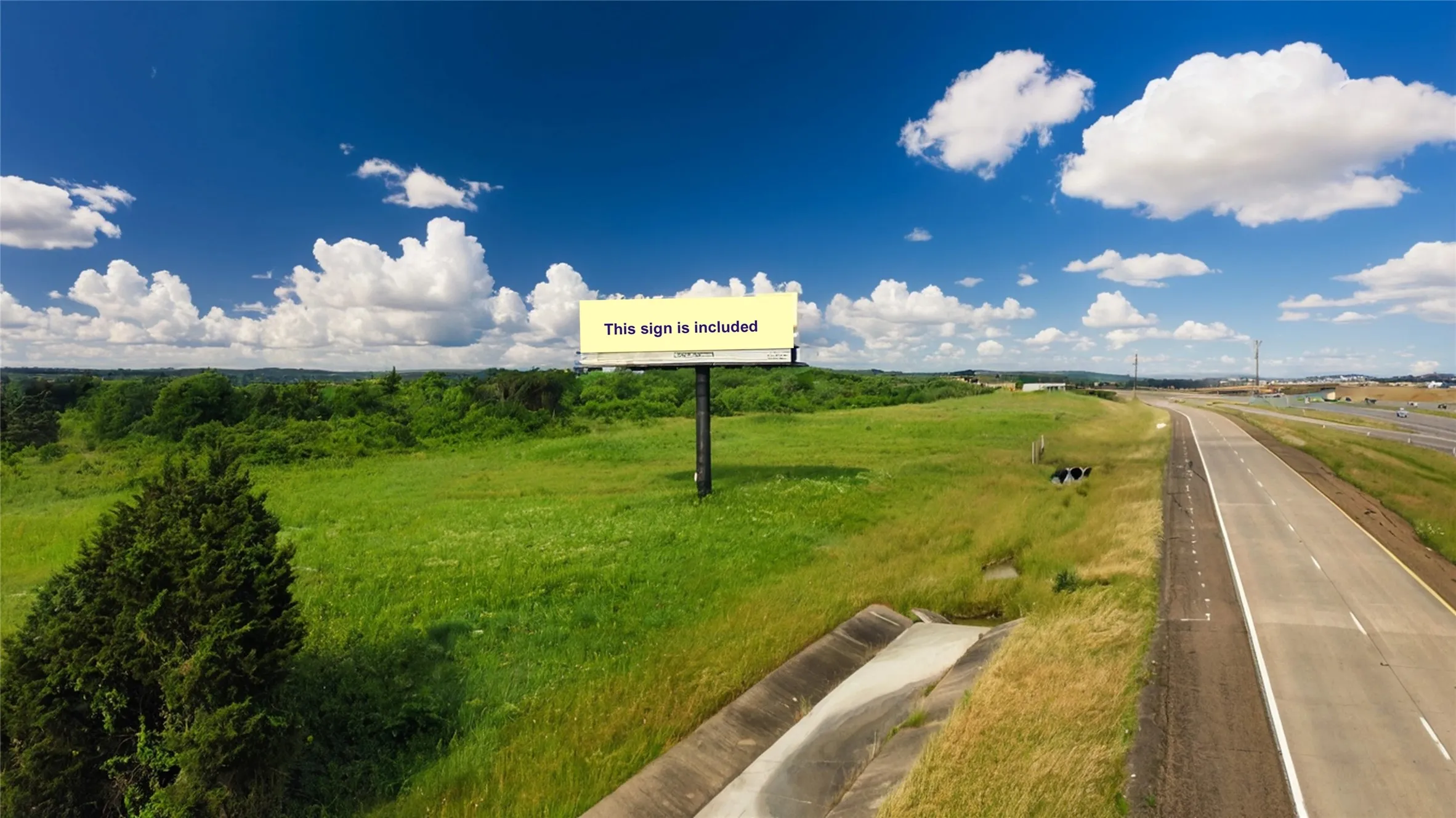 View of asphalt street with a view of rural / pastoral area