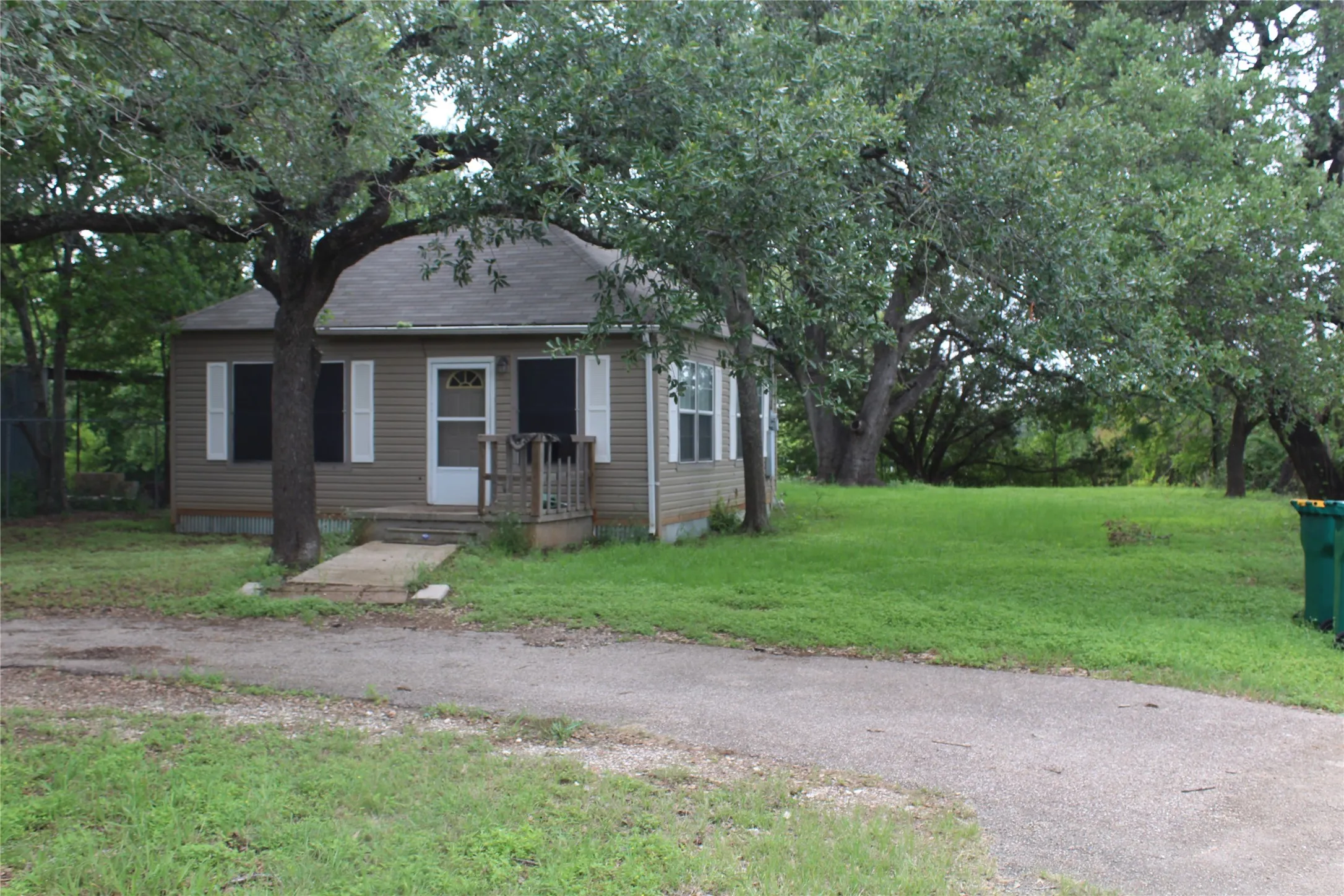 2/1 Single-story home featuring horizontal siding, a gabled roof, and a front porch