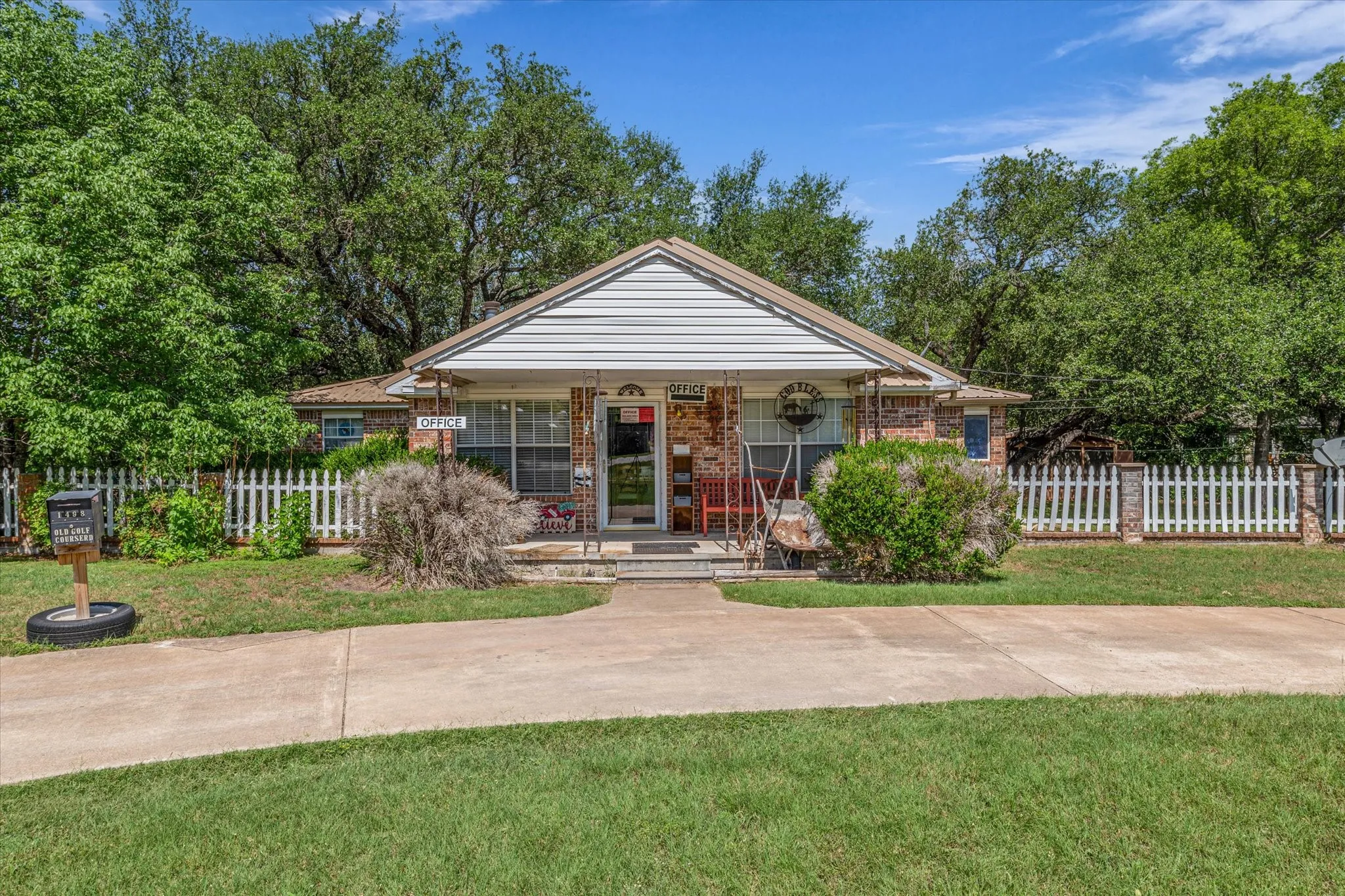 Bungalow-style house featuring covered porch and brick siding