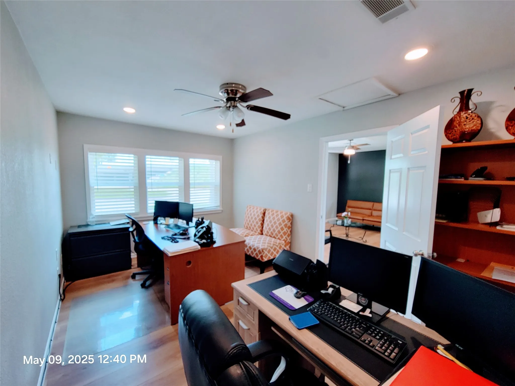Office area featuring a ceiling fan, recessed lighting, light wood-style floors, and baseboards