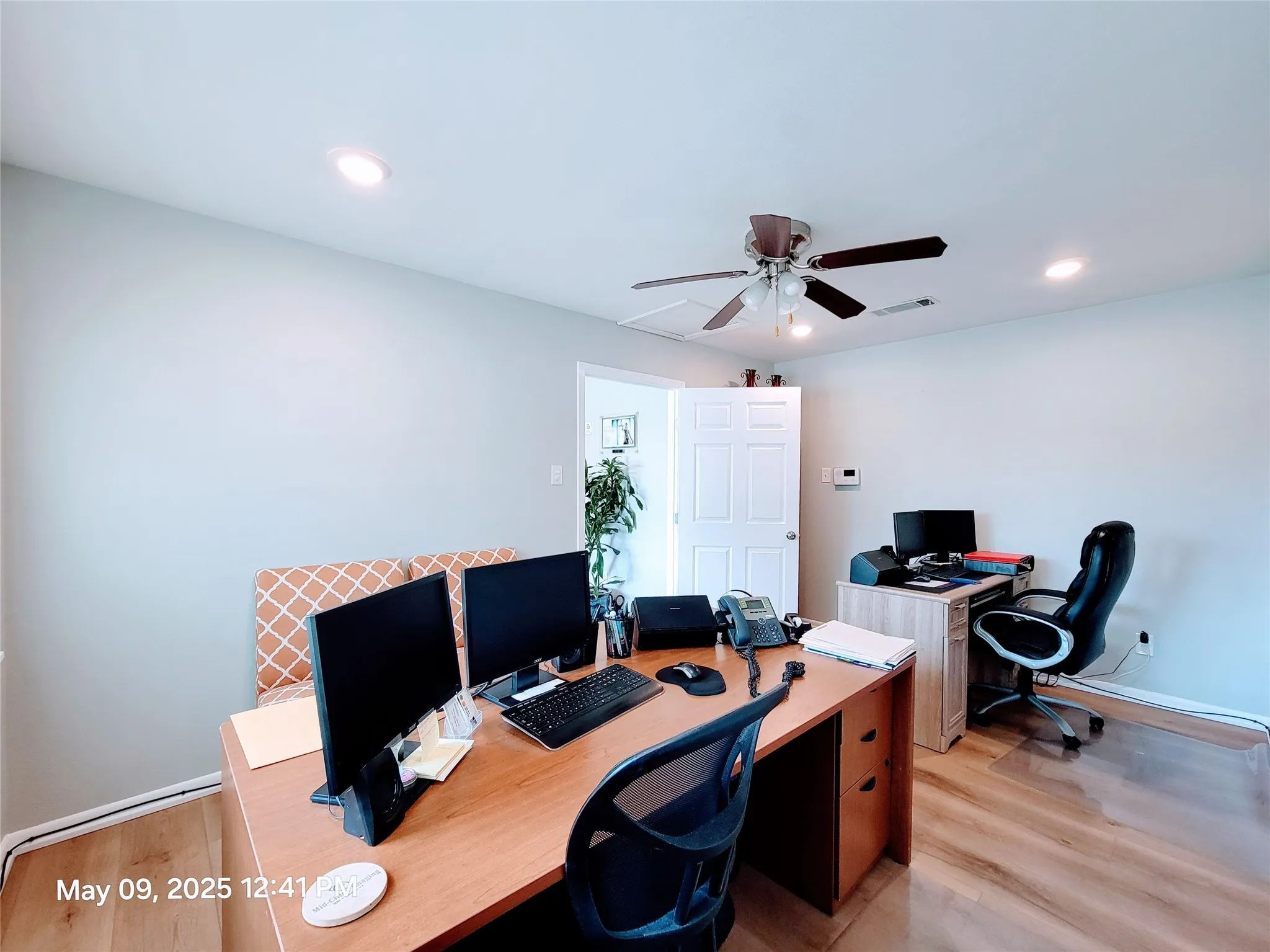 Office with a ceiling fan, light wood finished floors, and recessed lighting