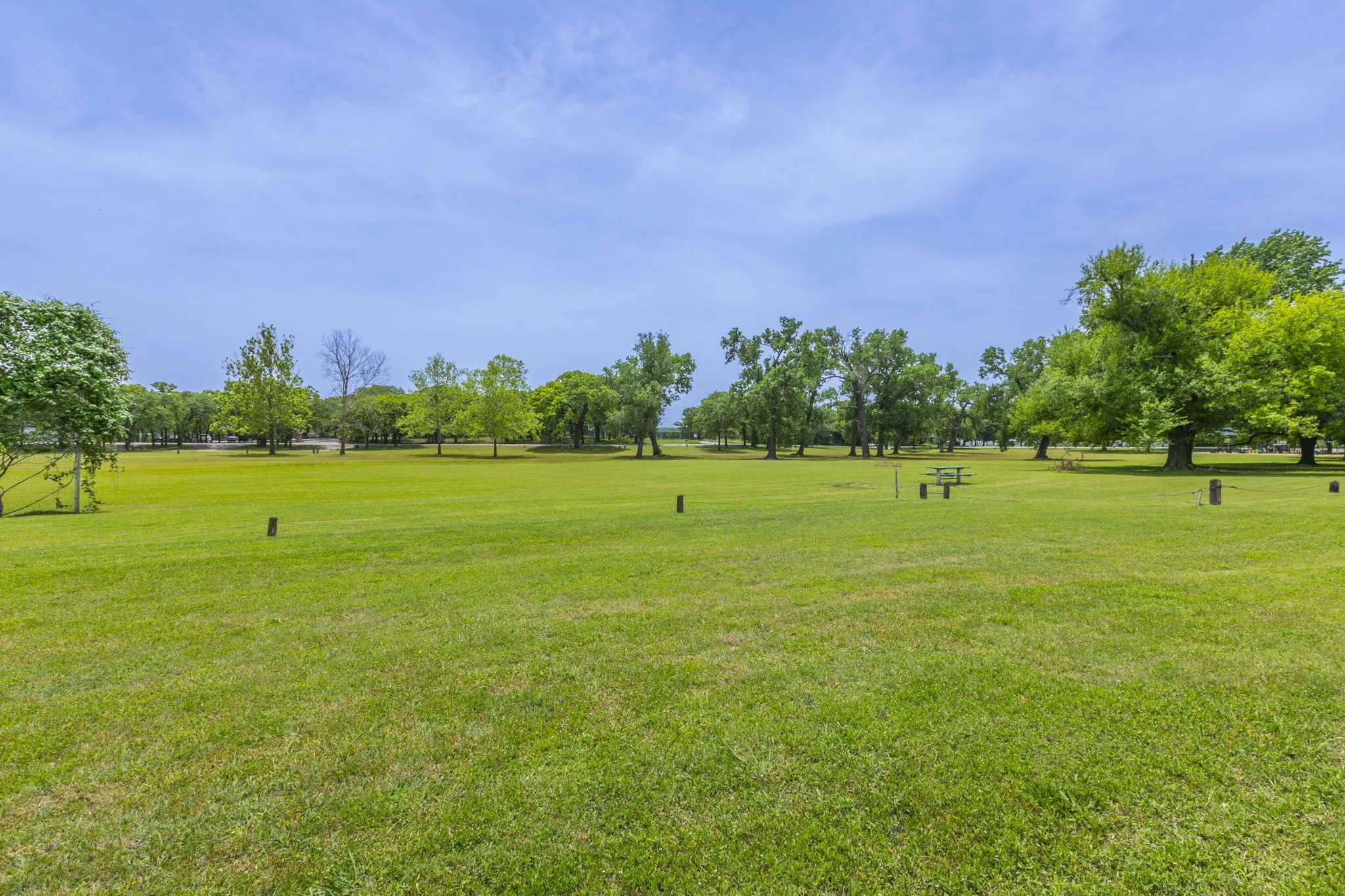 View of home's community with a lawn