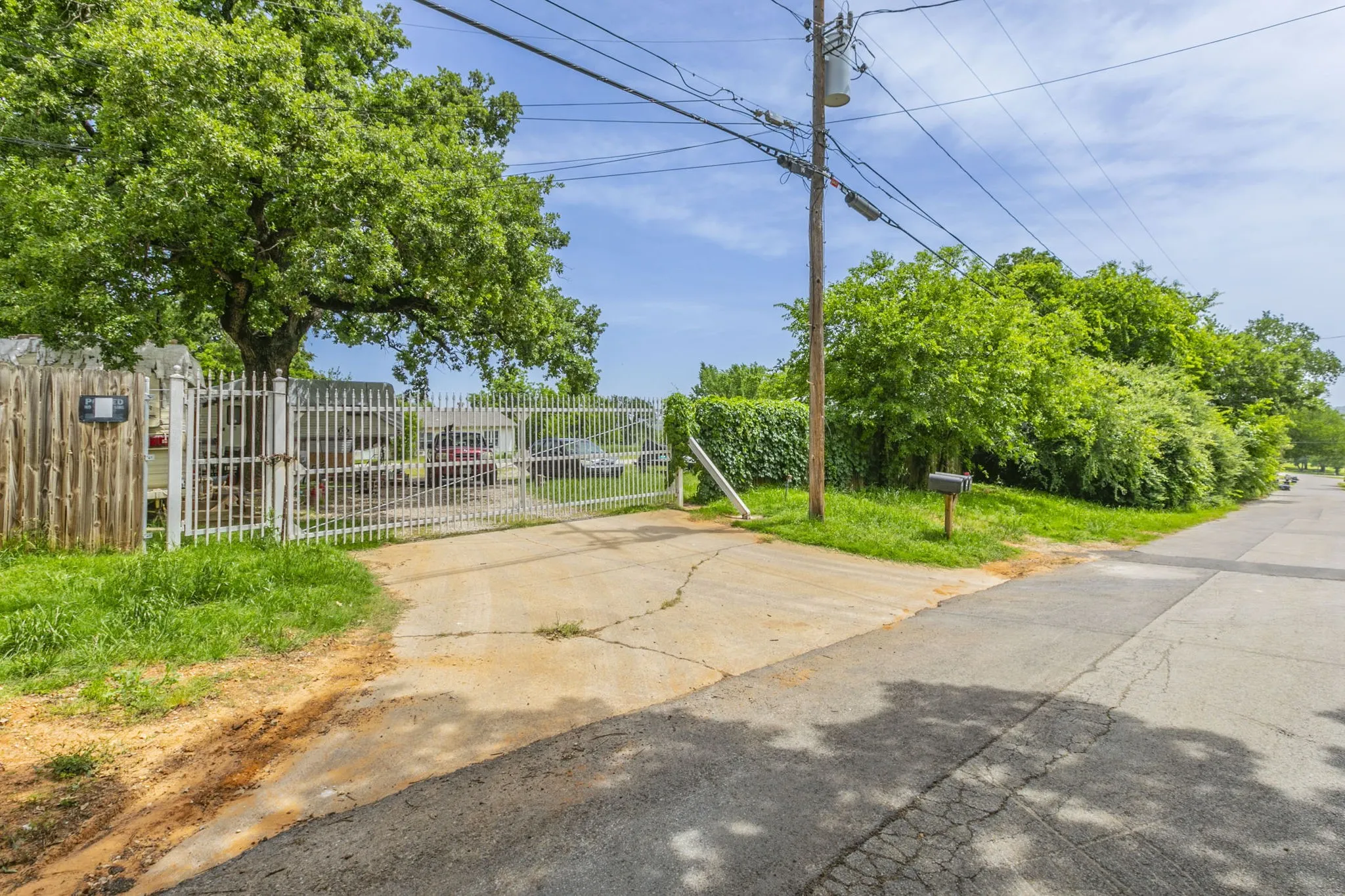 View of concrete surface featuring a gate