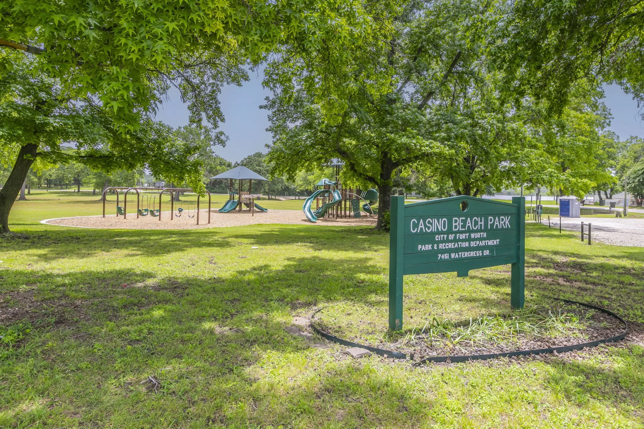 View of property's community with a lawn