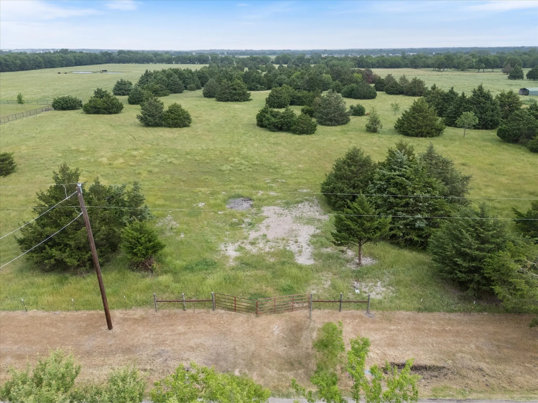 Aerial view of sparsely populated area with a pastoral area