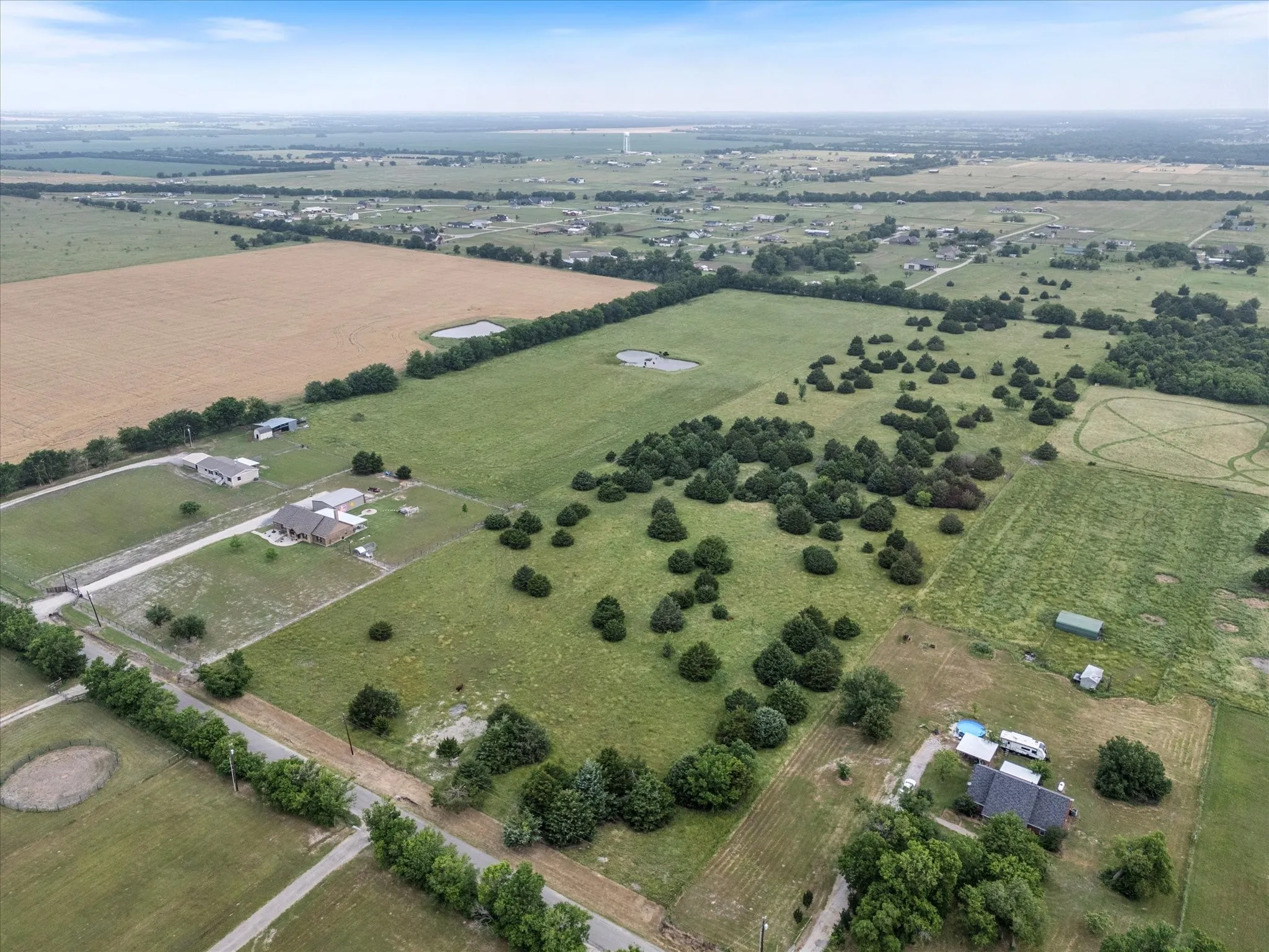 Aerial view of property's location with rural landscape and farmland