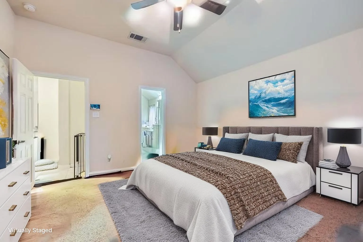 Carpeted bedroom with lofted ceiling and a ceiling fan
