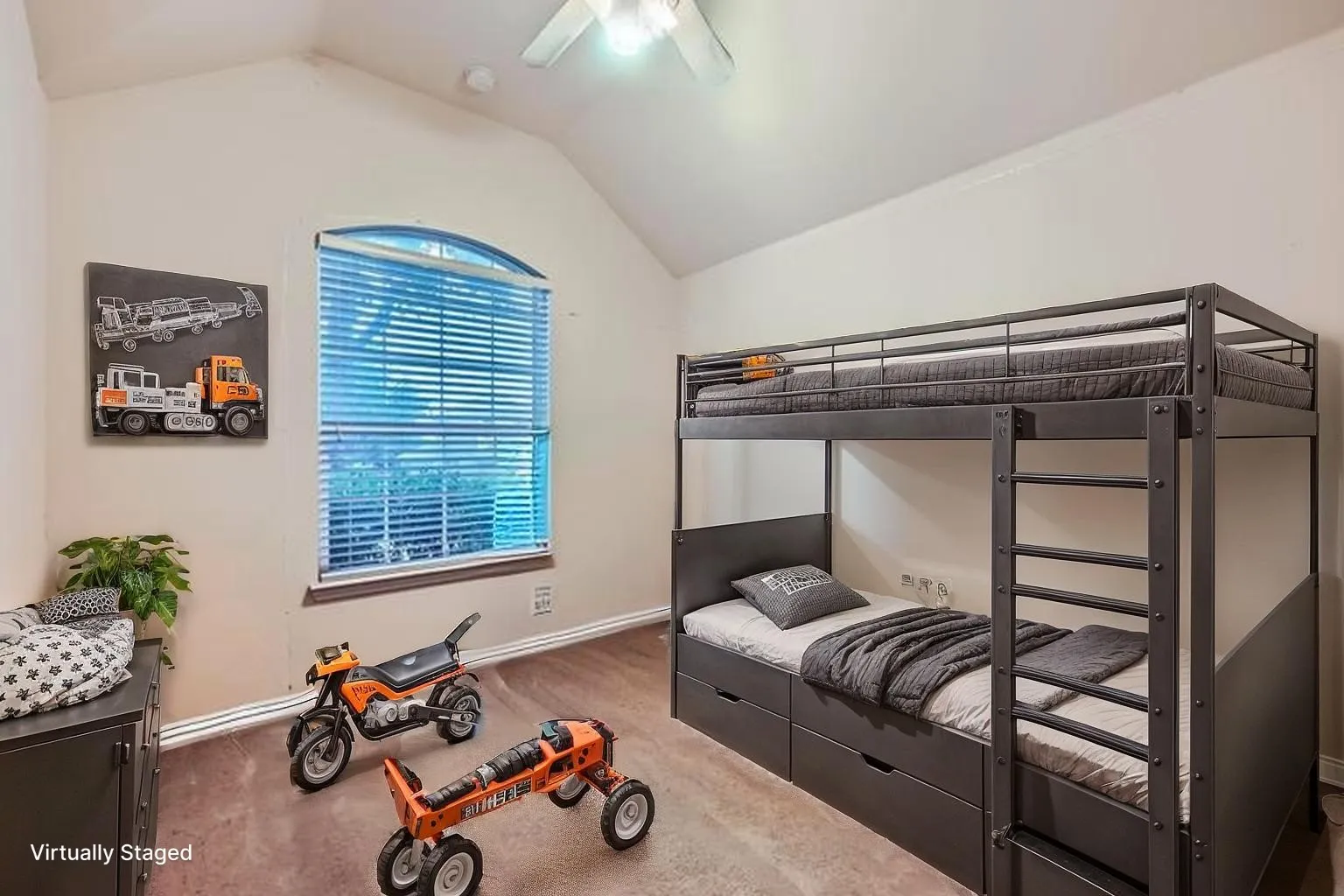 Carpeted bedroom with lofted ceiling, baseboards, and ceiling fan