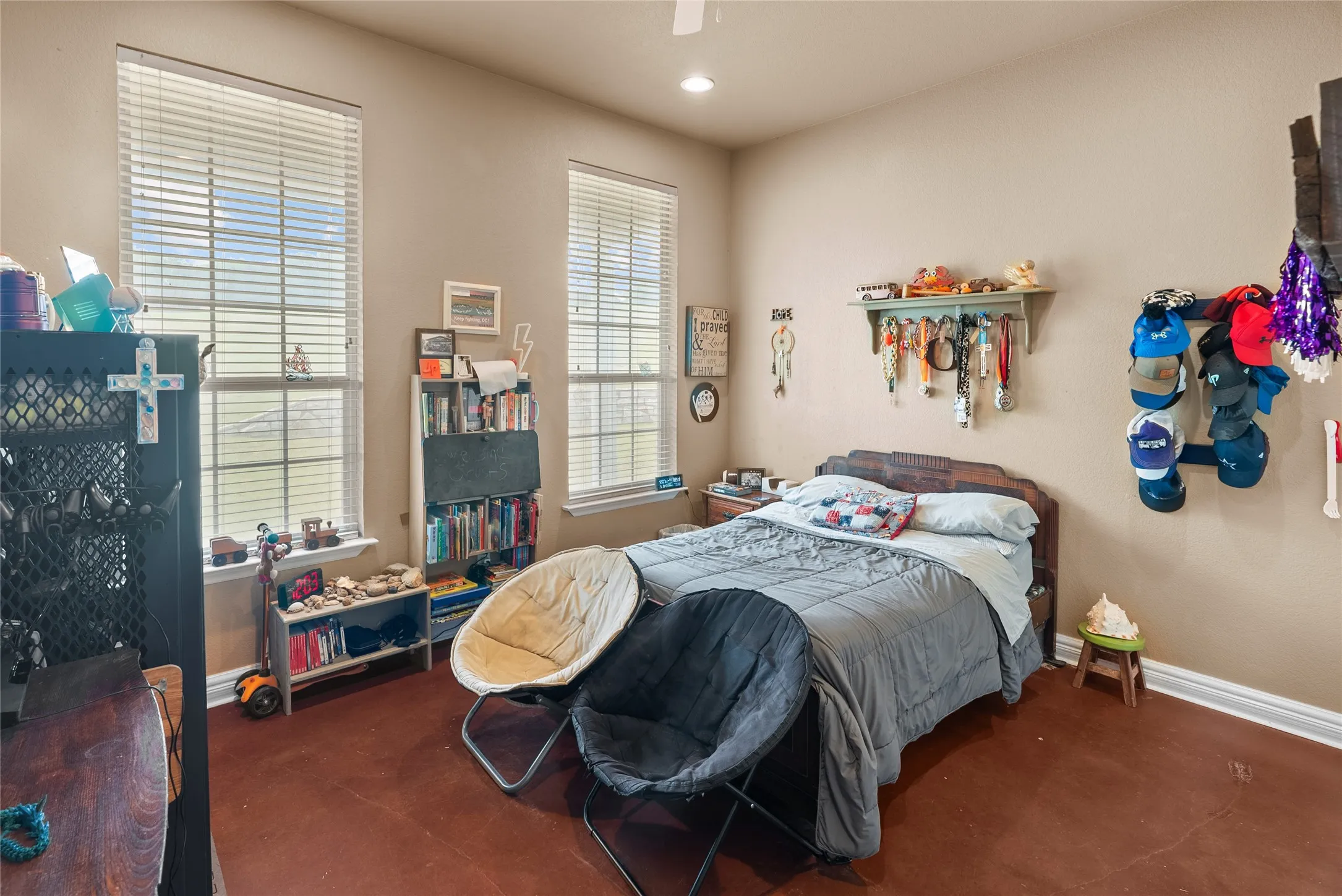 Bedroom with baseboards, recessed lighting, and finished concrete floors