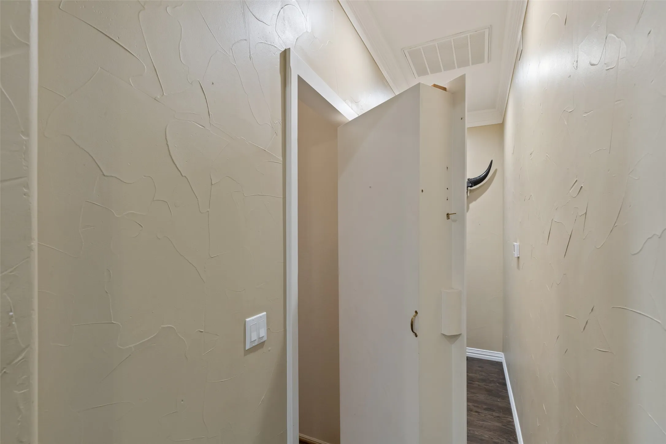 Hidden door behind a shelf leads you to the downstairs wine room/basement!