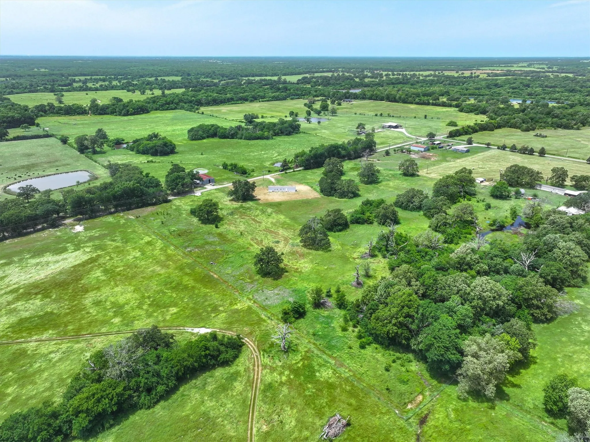 Aerial view of property and surrounding area with rural landscape