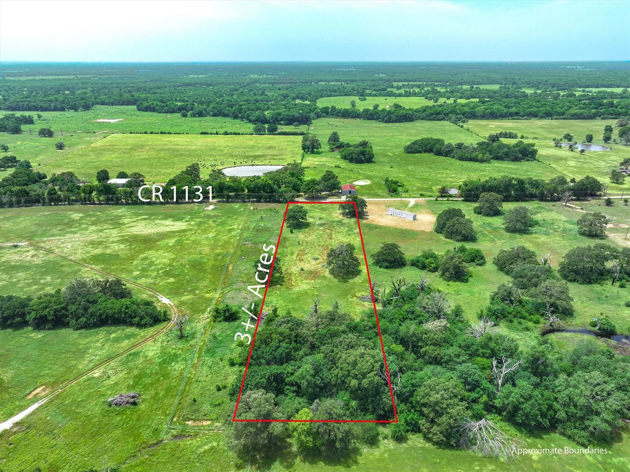 Aerial view of back side of property with approx parcel outlined