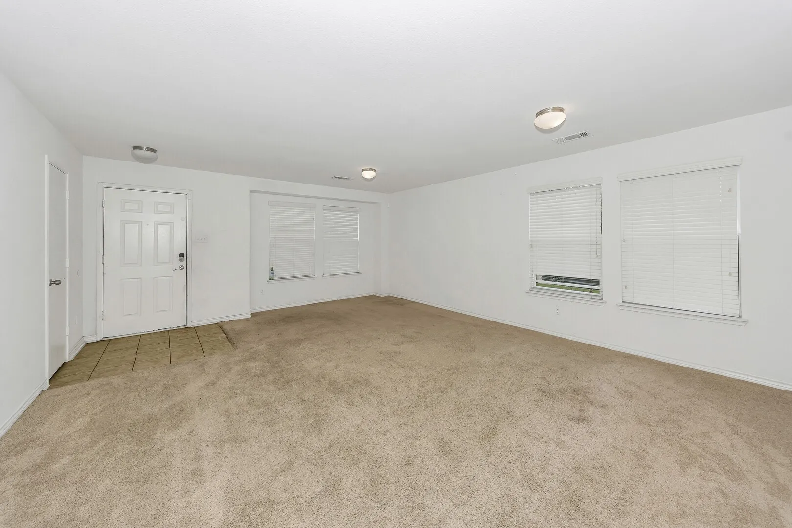 Unfurnished room featuring carpet flooring and baseboards
