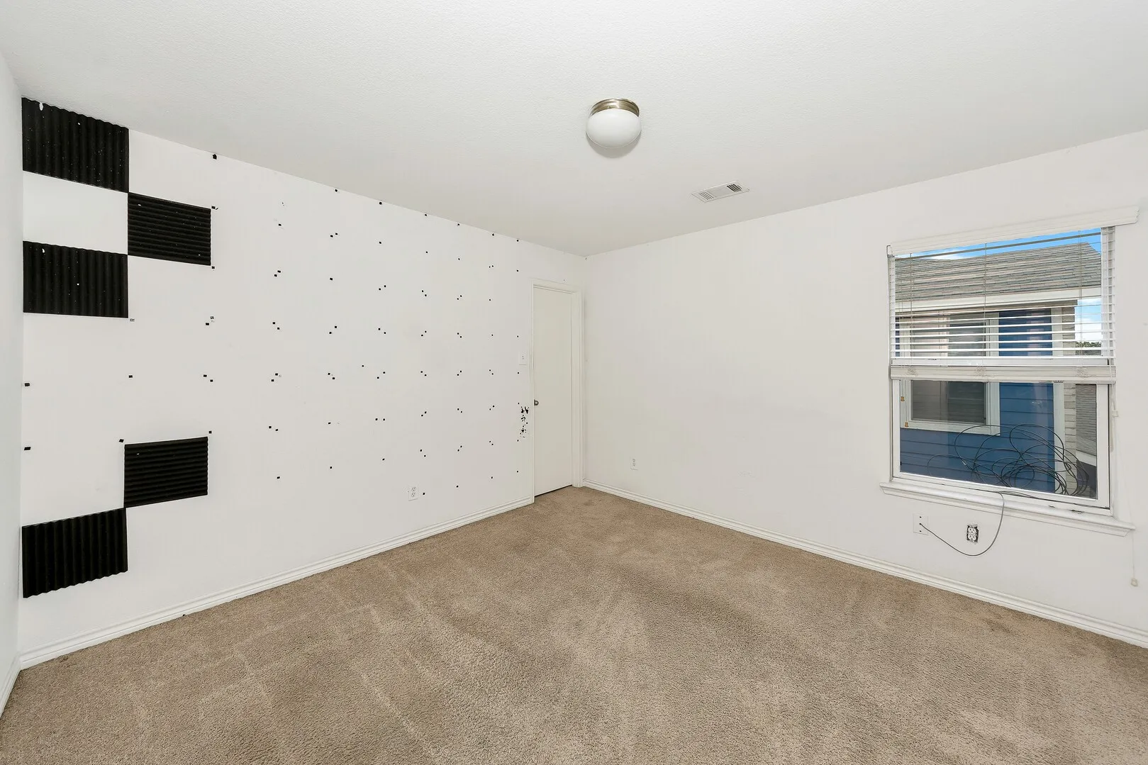 Unfurnished room featuring light colored carpet and baseboards