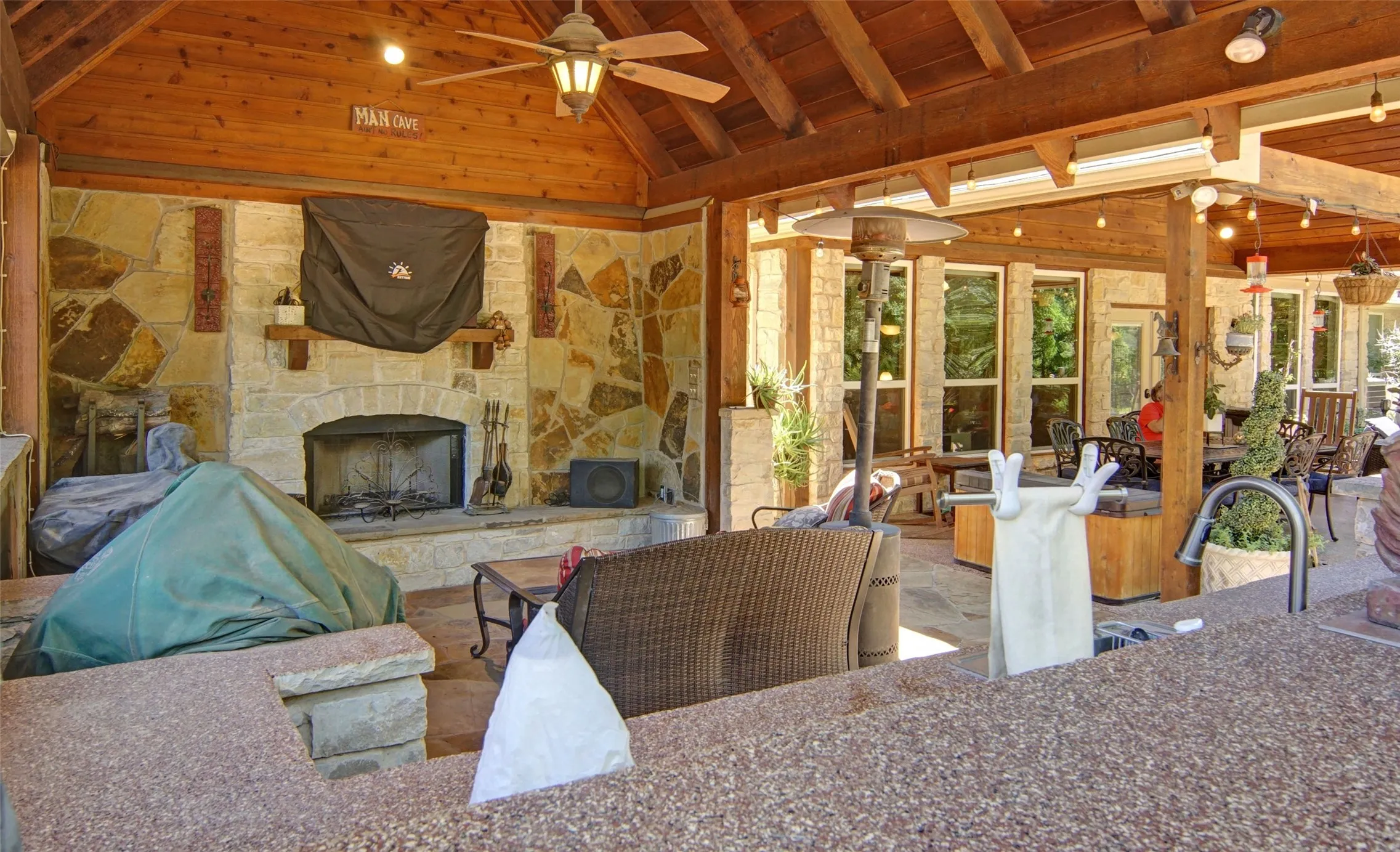 Outdoor kitchen area has it ALL! Fridge, ice maker, fireplace with TV. Let's cook outside every night of the week!