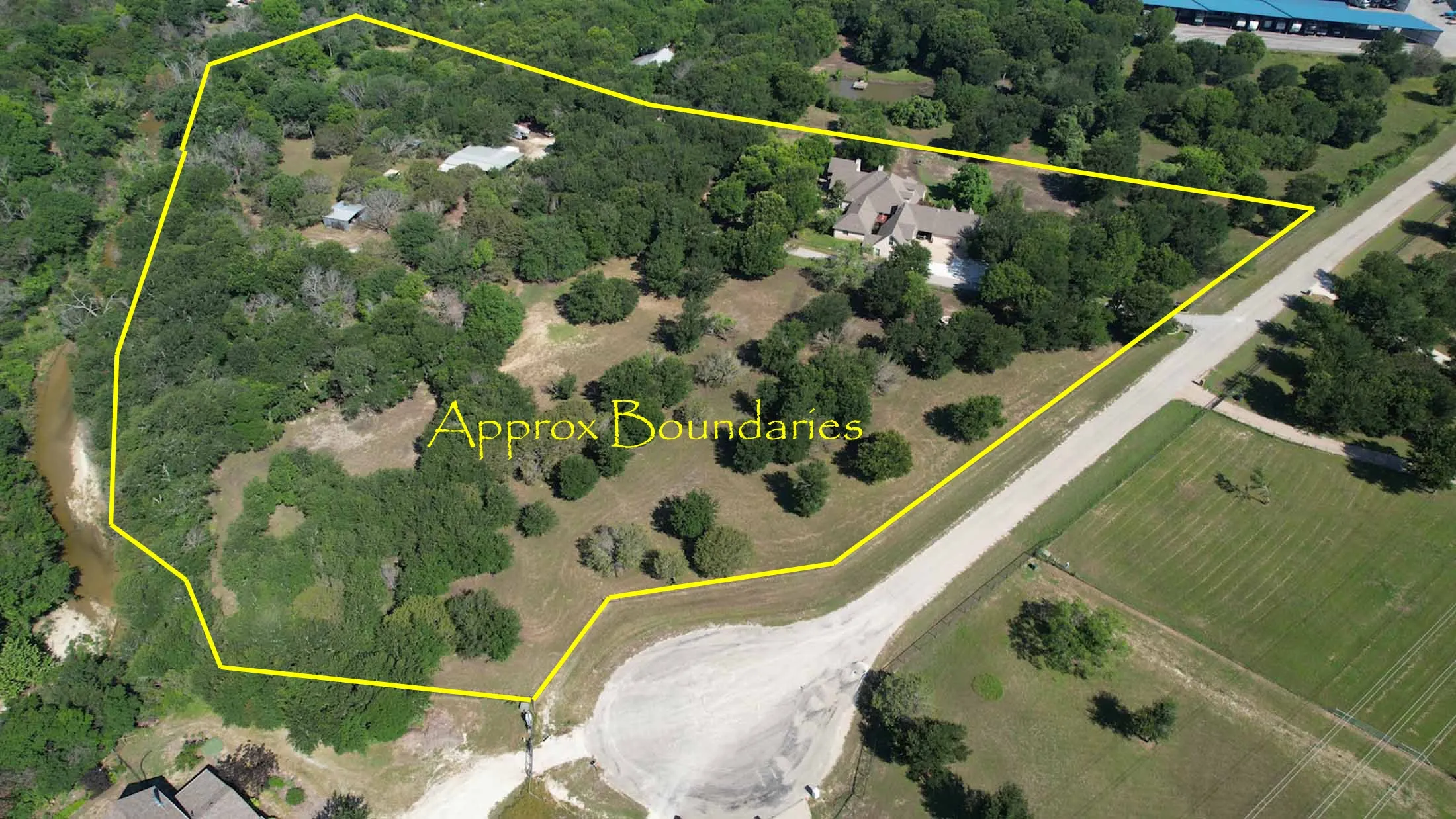 Approximate outline of your new home acreage. The property line does enter into Bear Creek behind the barns and workshops.