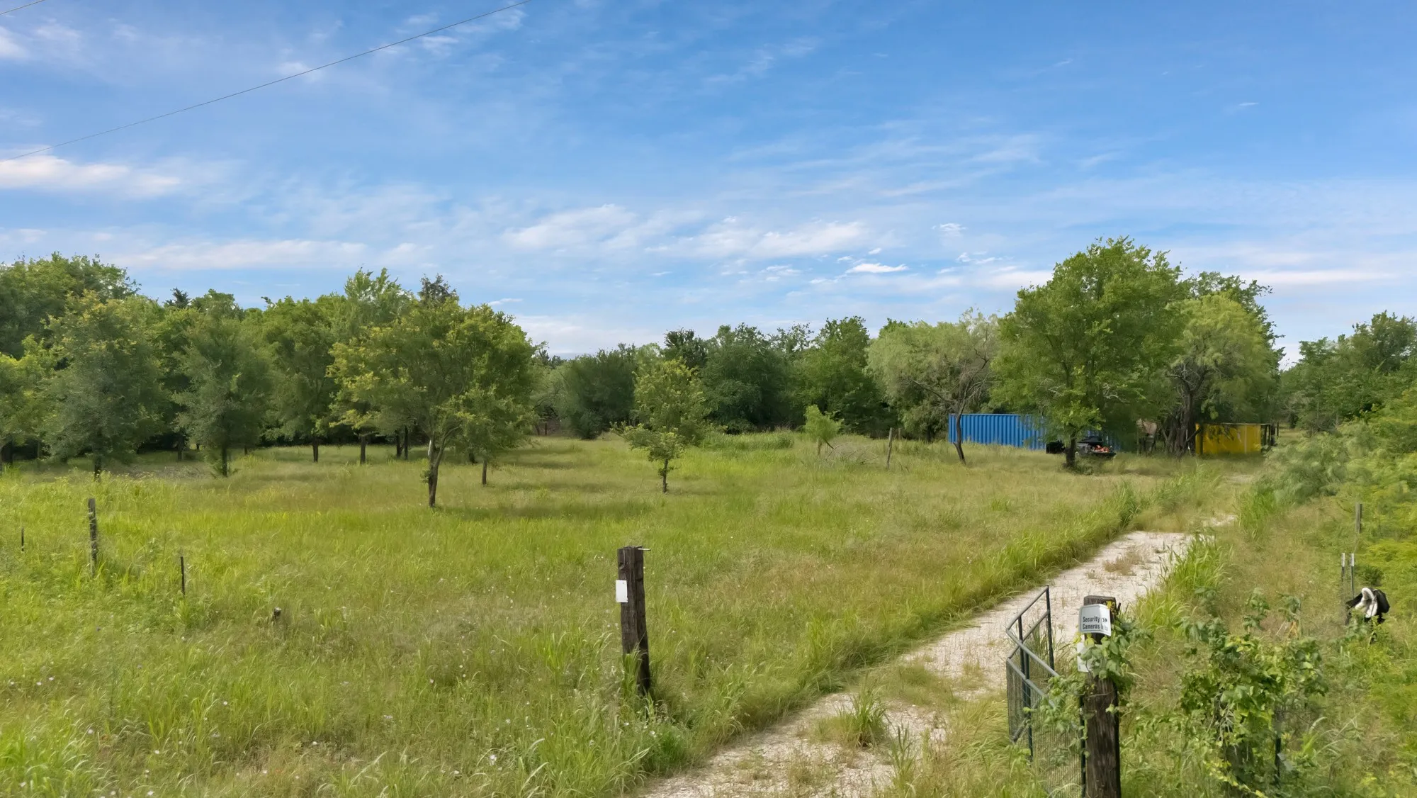 View of yard with a rural view
