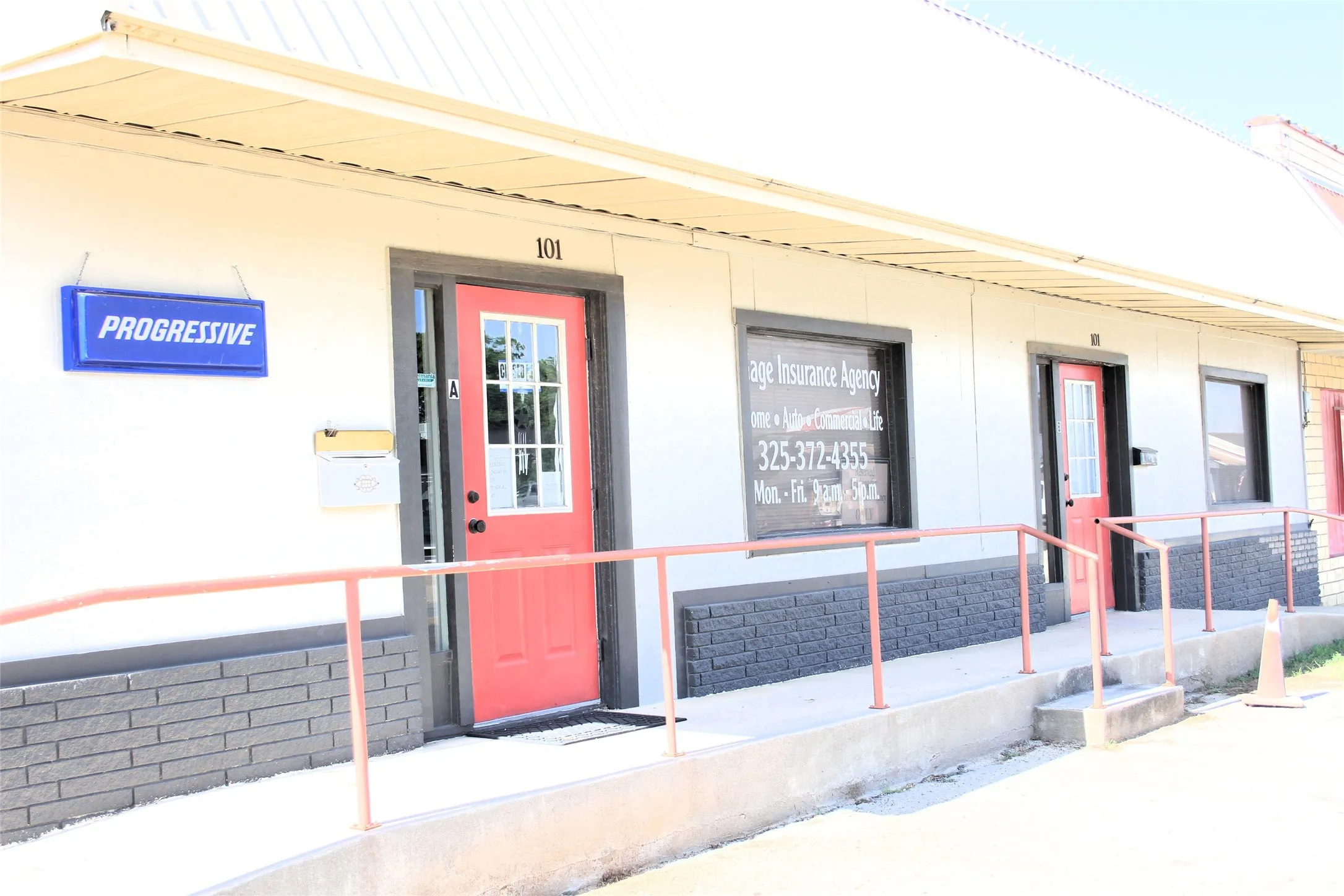 View of exterior entry with covered porch