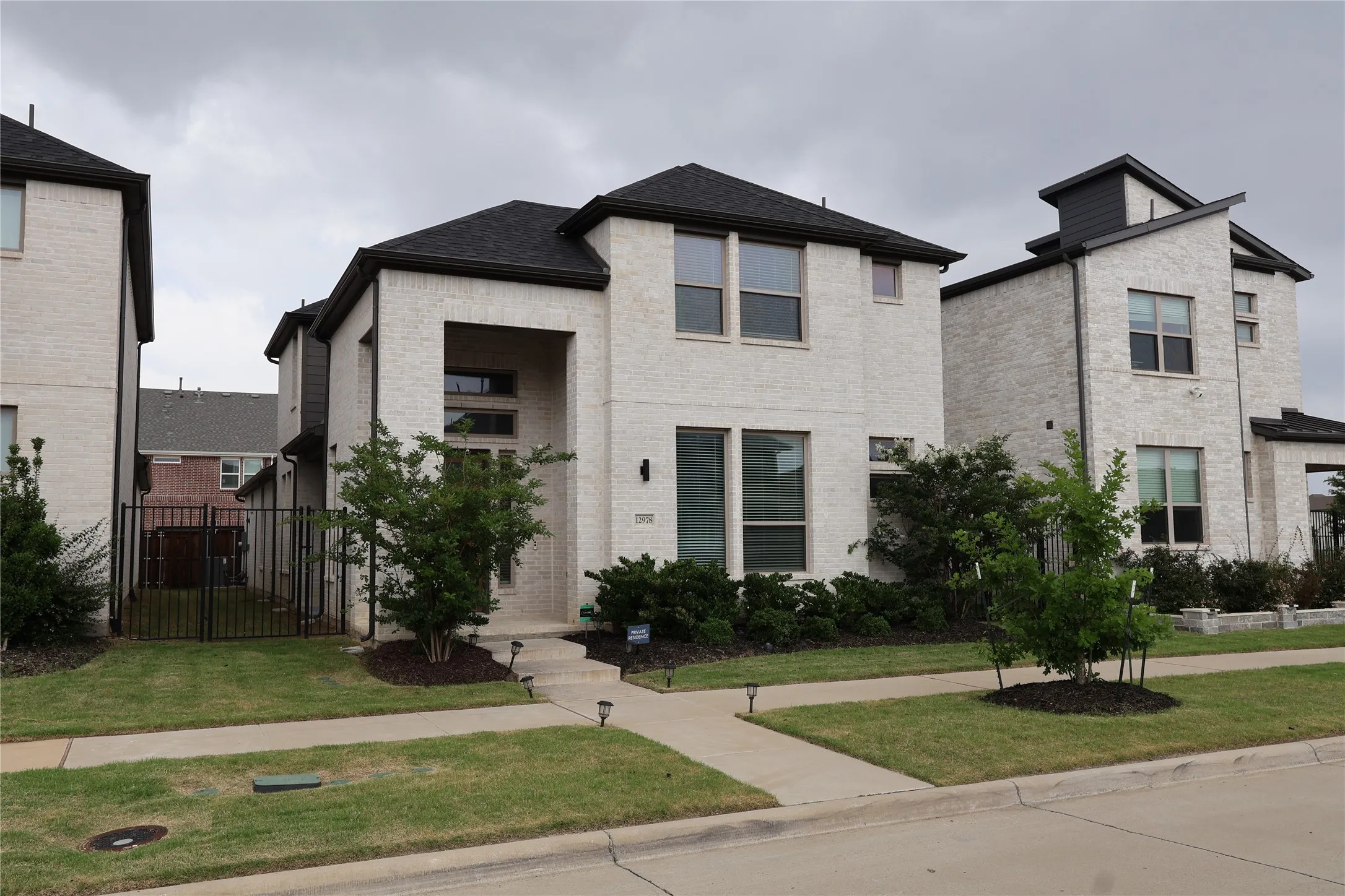 View of front of house with brick siding